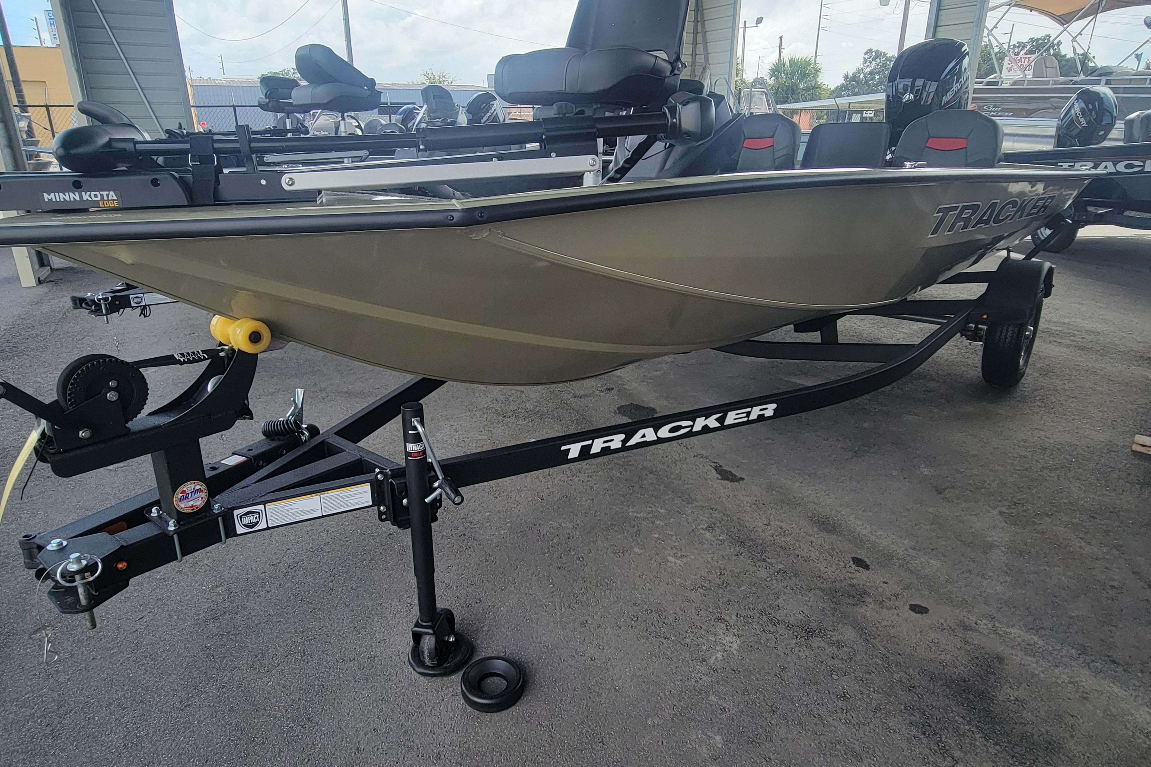 2026 Tracker Pro Team 175 Crappie Edition boat on trailer, parked in a covered area.