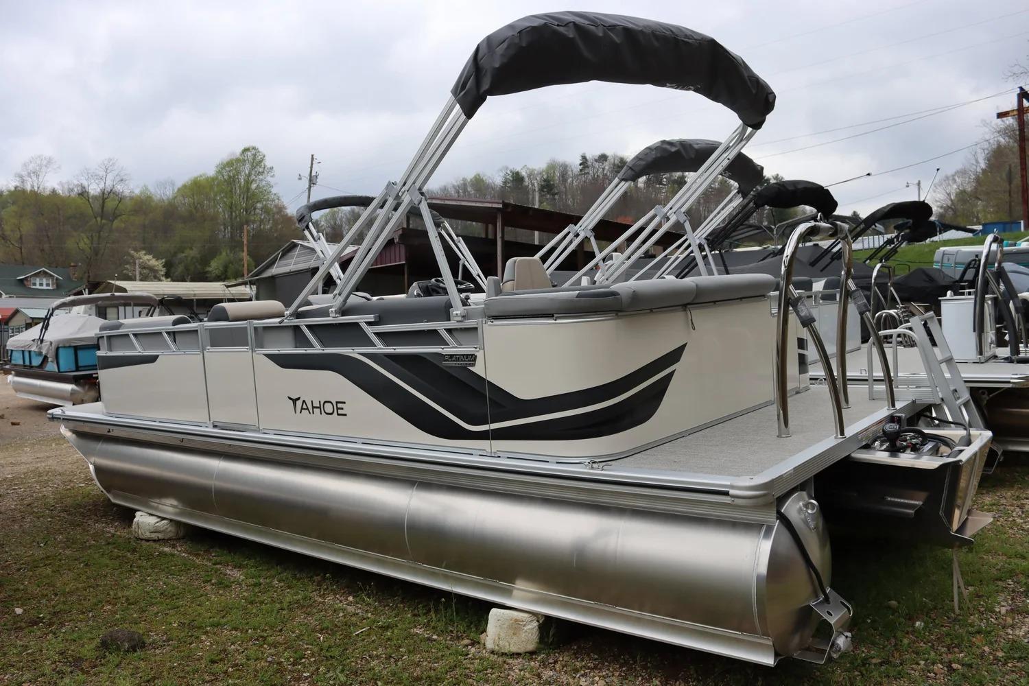 2025 Tahoe Pontoon Sport 85 Cruise boat with sleek design, parked outdoors.