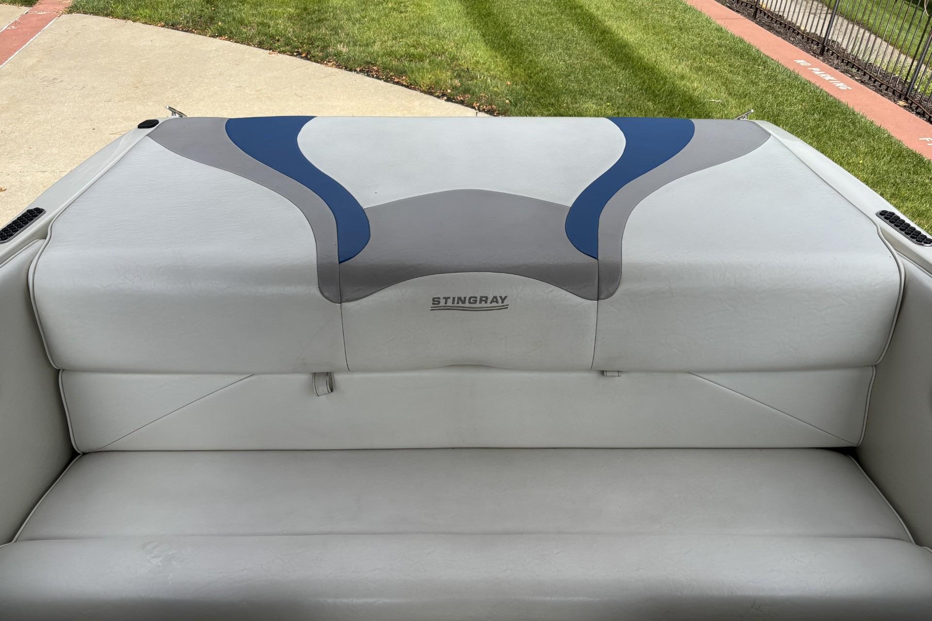 2007 Stingray 180 RX boat seat with gray and blue upholstery design.