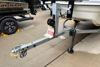 2025 Mako Pro Skiff 13 CC boat trailer parked on concrete surface.