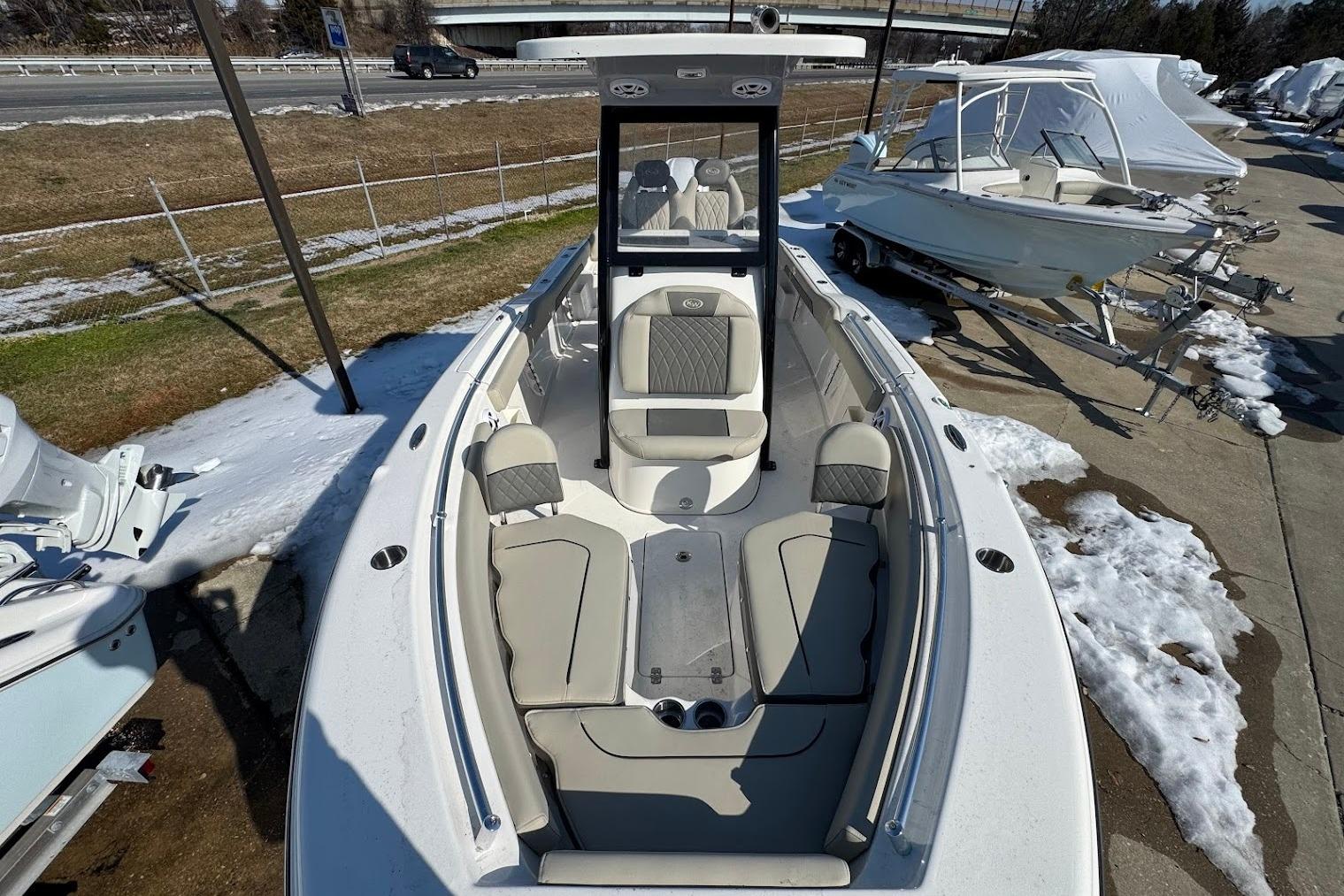 2026 Key West 239 FS boat with sleek seating, parked on snowy ground.