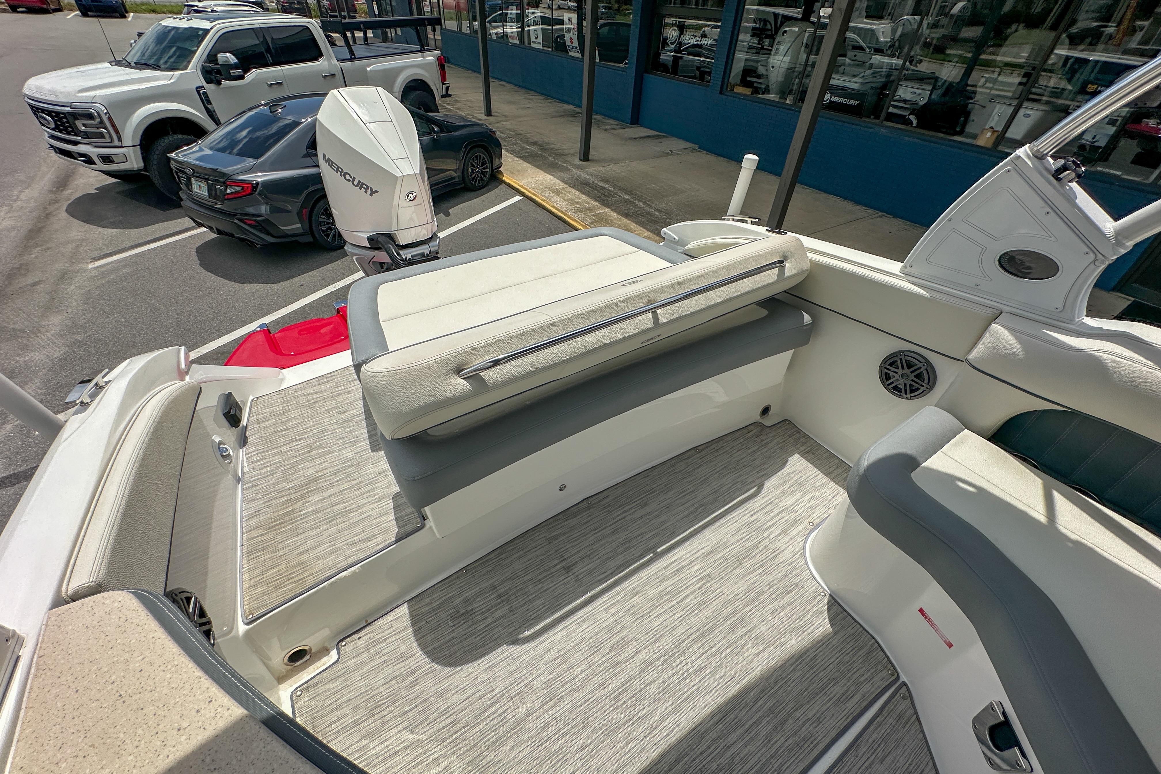 2022 Cobalt 25SC boat interior with seating and Mercury outboard motor.