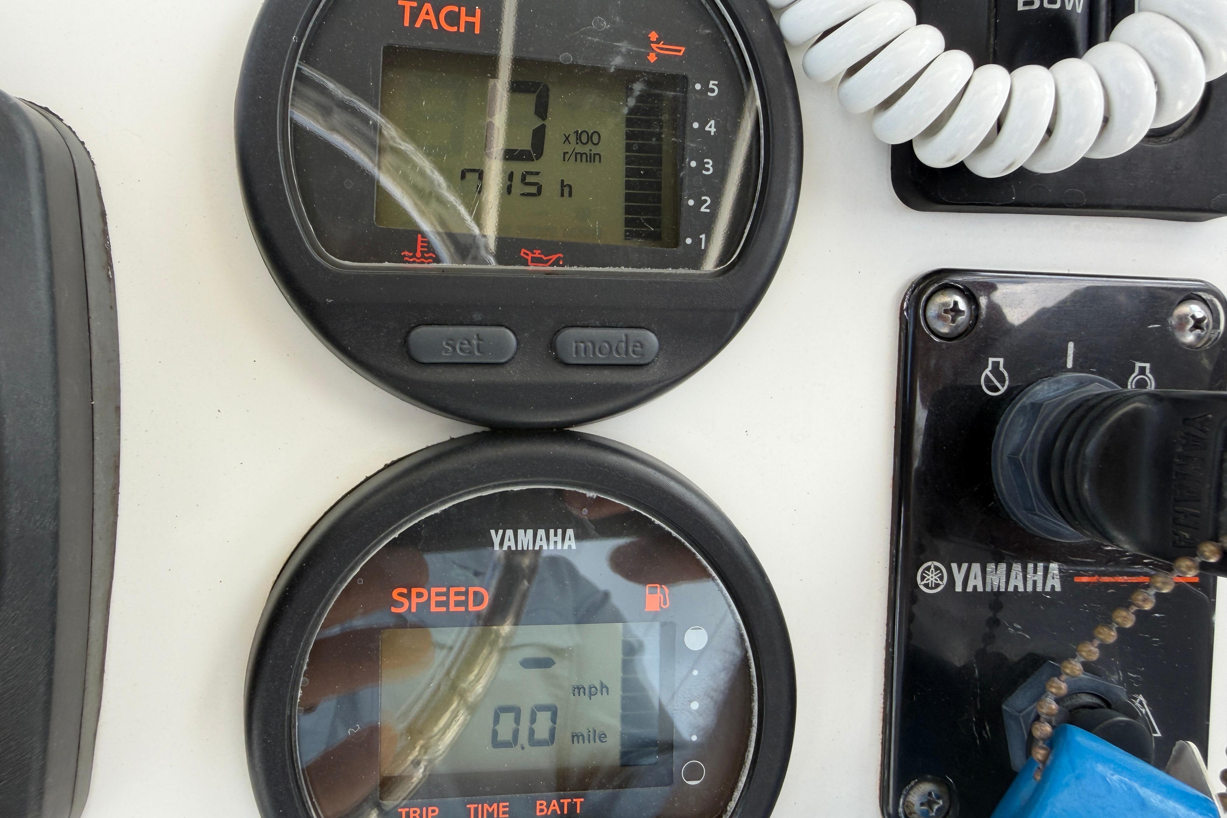 Control panel of a 2015 Sea Hunt Triton 225 boat with Yamaha gauges.
