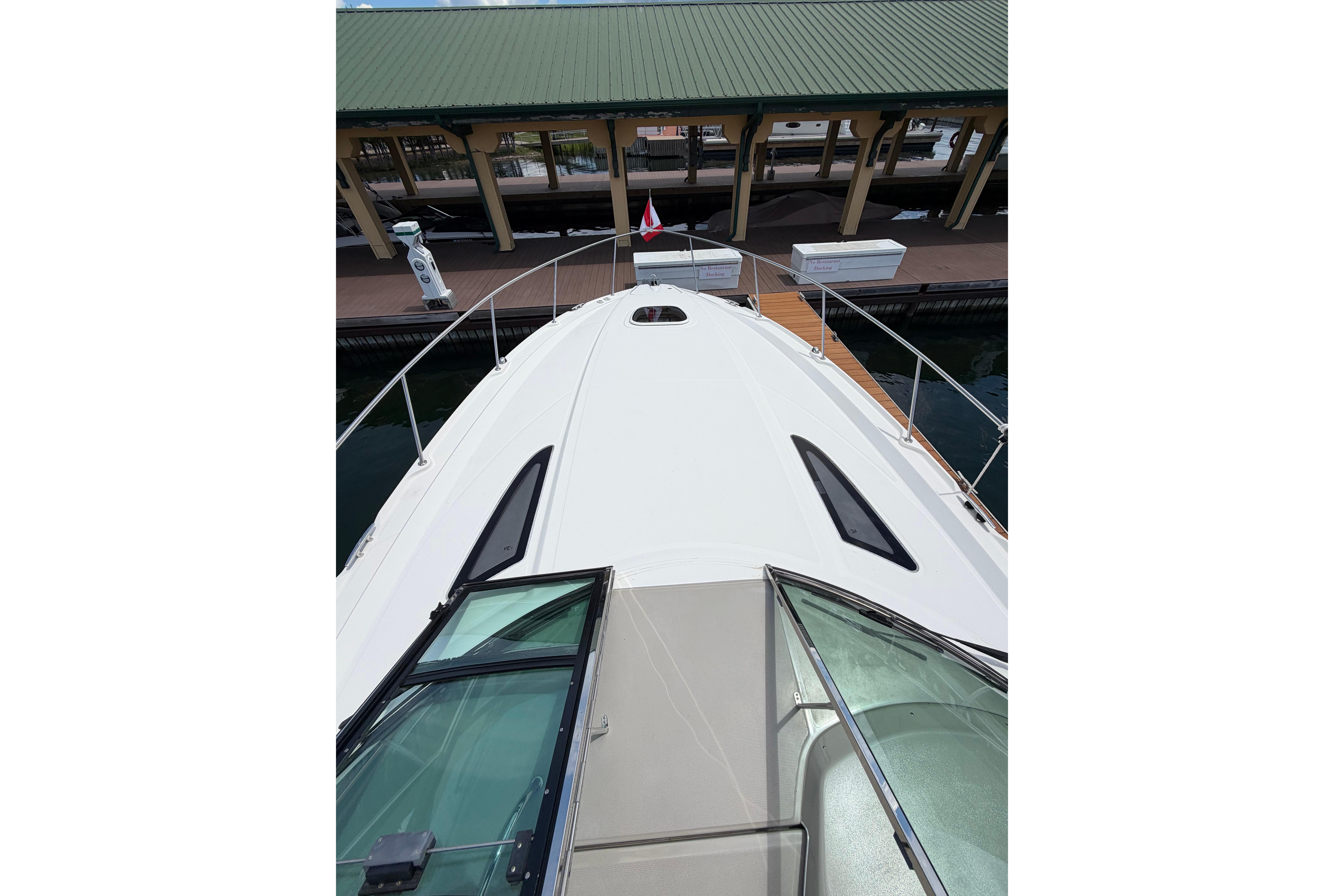 2012 Sea Ray Sundancer 370 yacht docked at marina, view from bow.