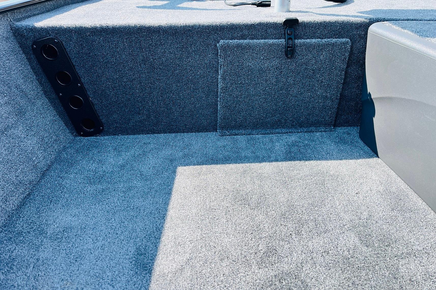 Interior of 2026 Tracker Bass Tracker Classic XL boat with carpeted flooring.