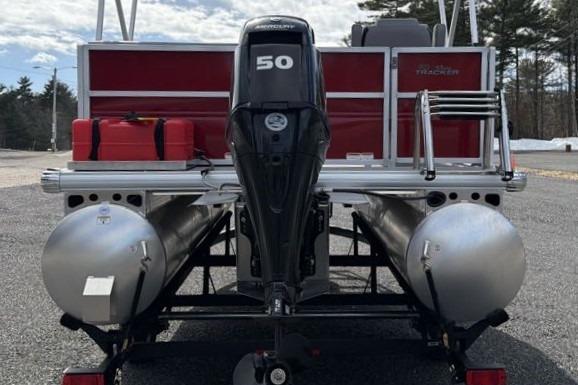 2026 Sun Tracker Party Barge 16 DLX pontoon boat with 50 HP motor, rear view.