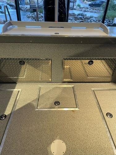 2024 Spartan 185 Astoria boat interior with storage compartments.
