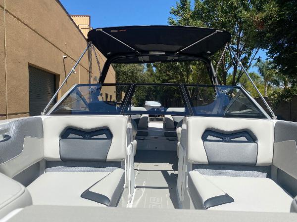 2025 Scarab 235 SE boat interior with modern seating and canopy.