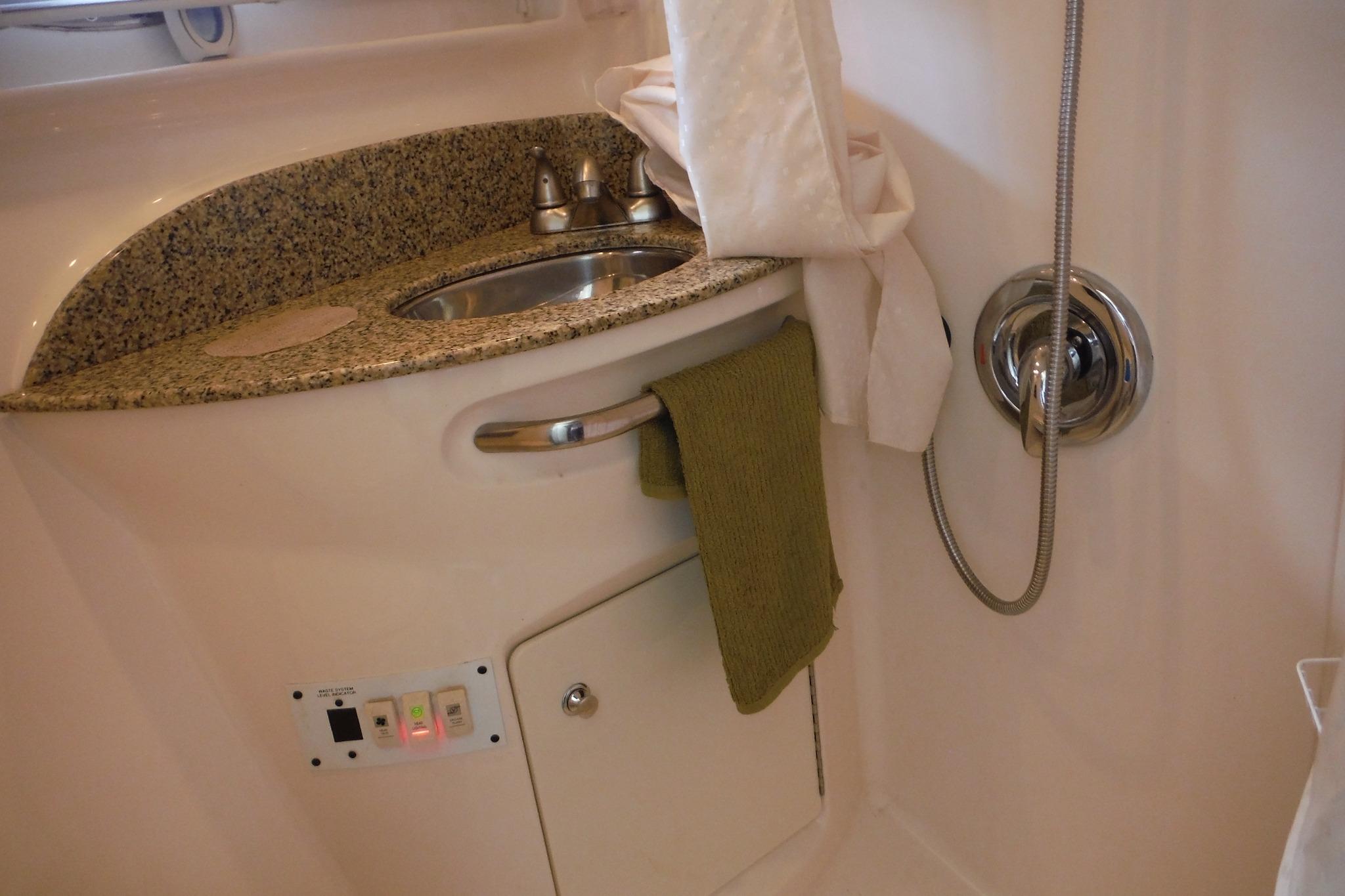 2005 Chaparral Signature 350 bathroom with granite countertop and stainless steel sink.