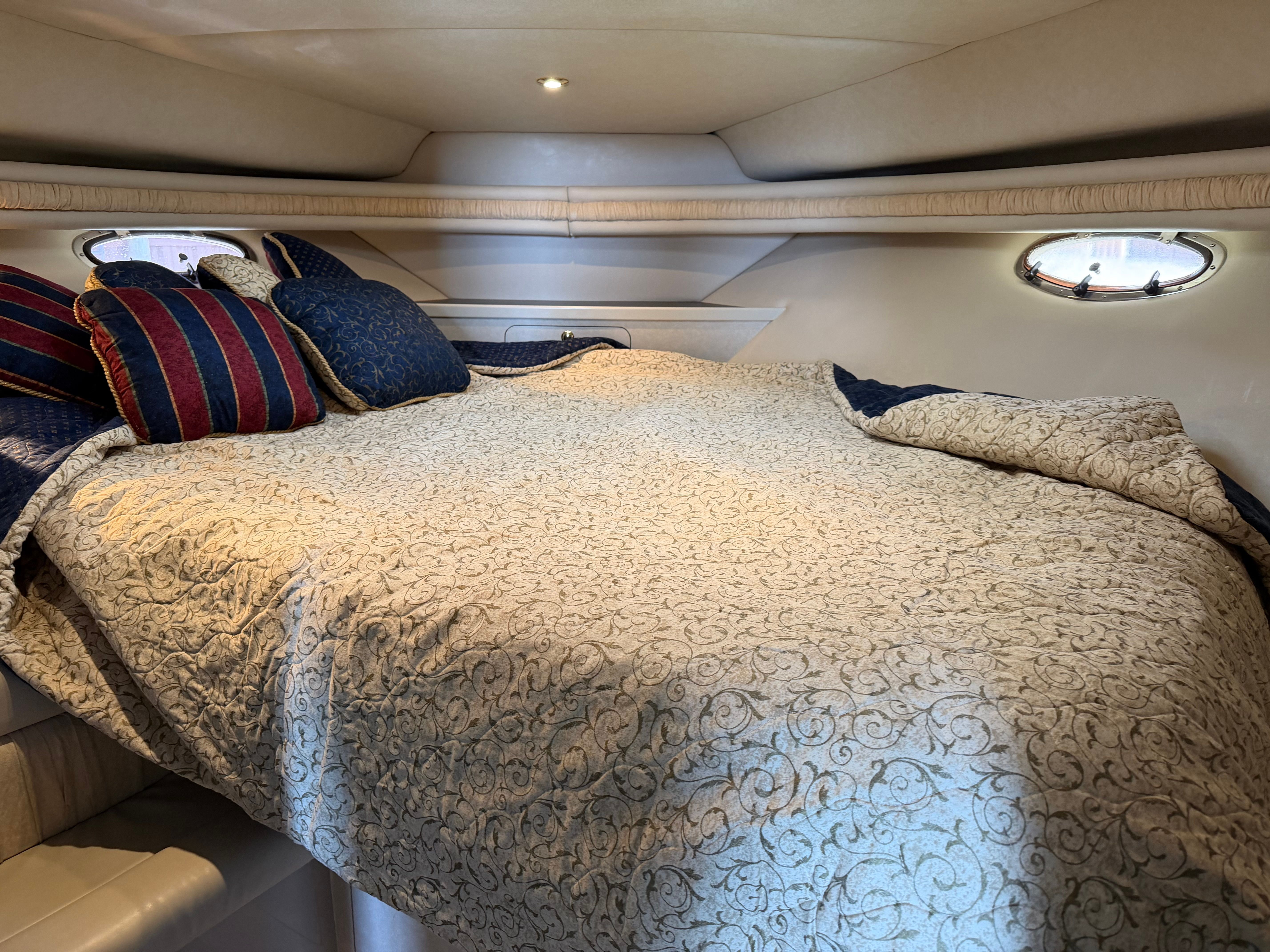 Interior of a 1997 Regal Commodore with cozy bed.