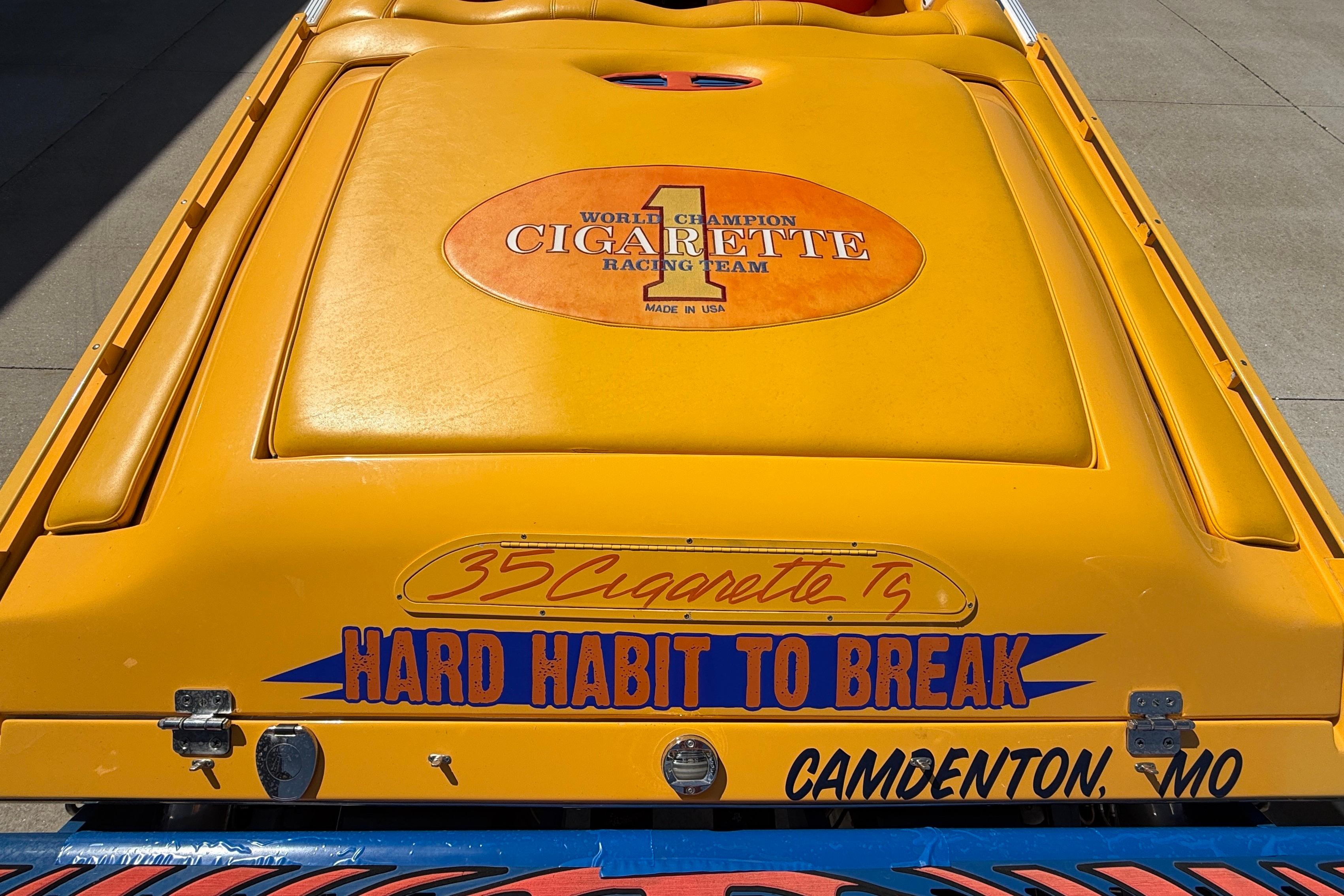 2002 Cigarette 35' Cafe Racer boat, yellow with "Hard Habit to Break" text, Camdenton, MO.