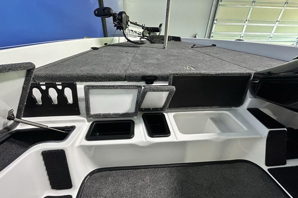 2026 Phoenix 818 Pro boat interior with storage compartments and fishing rod holders.