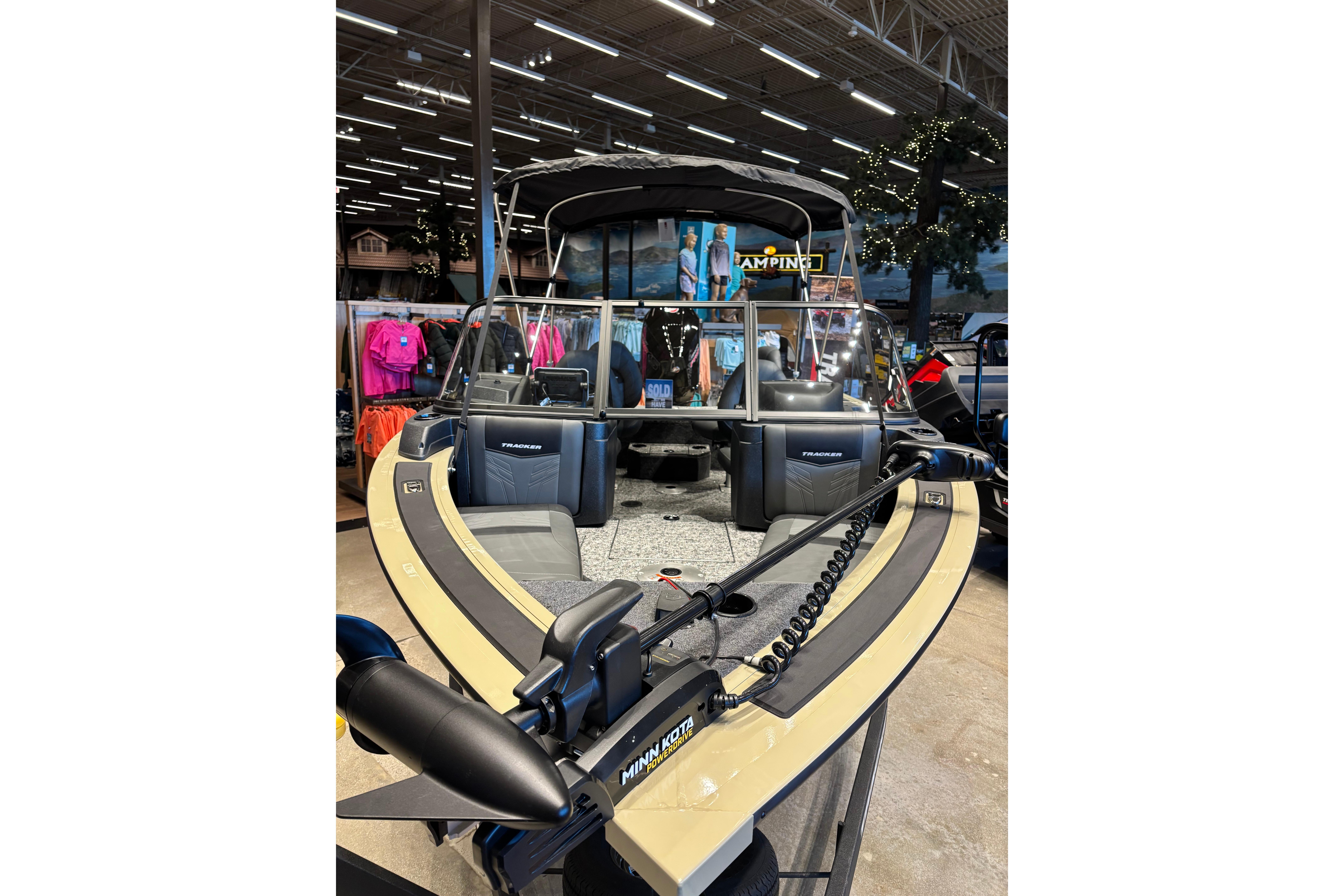 2026 Tracker Targa V-18 Combo boat displayed indoors with fishing gear.