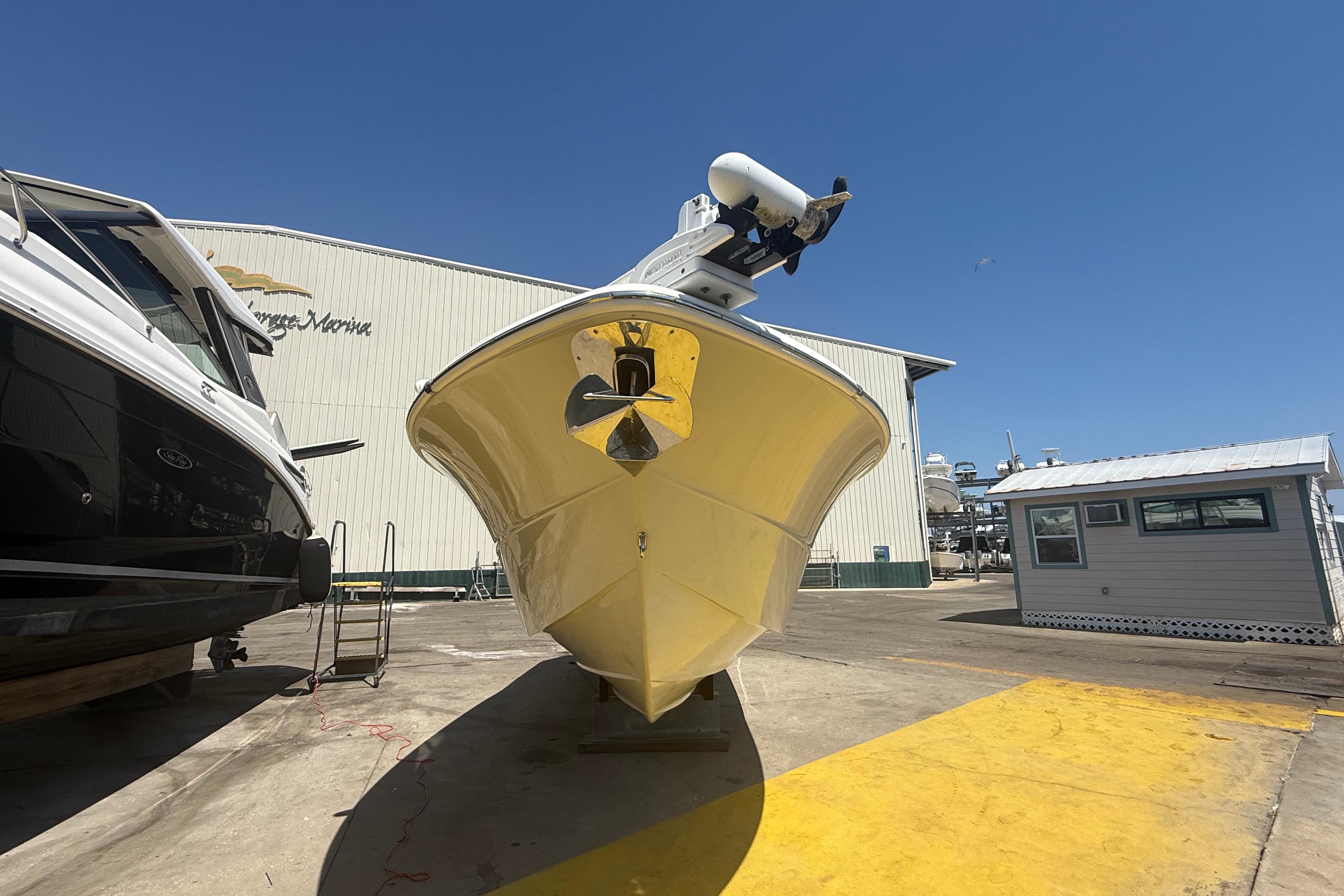 2019 Key West Billistic 281 Center Console boat at marina, sunny day.