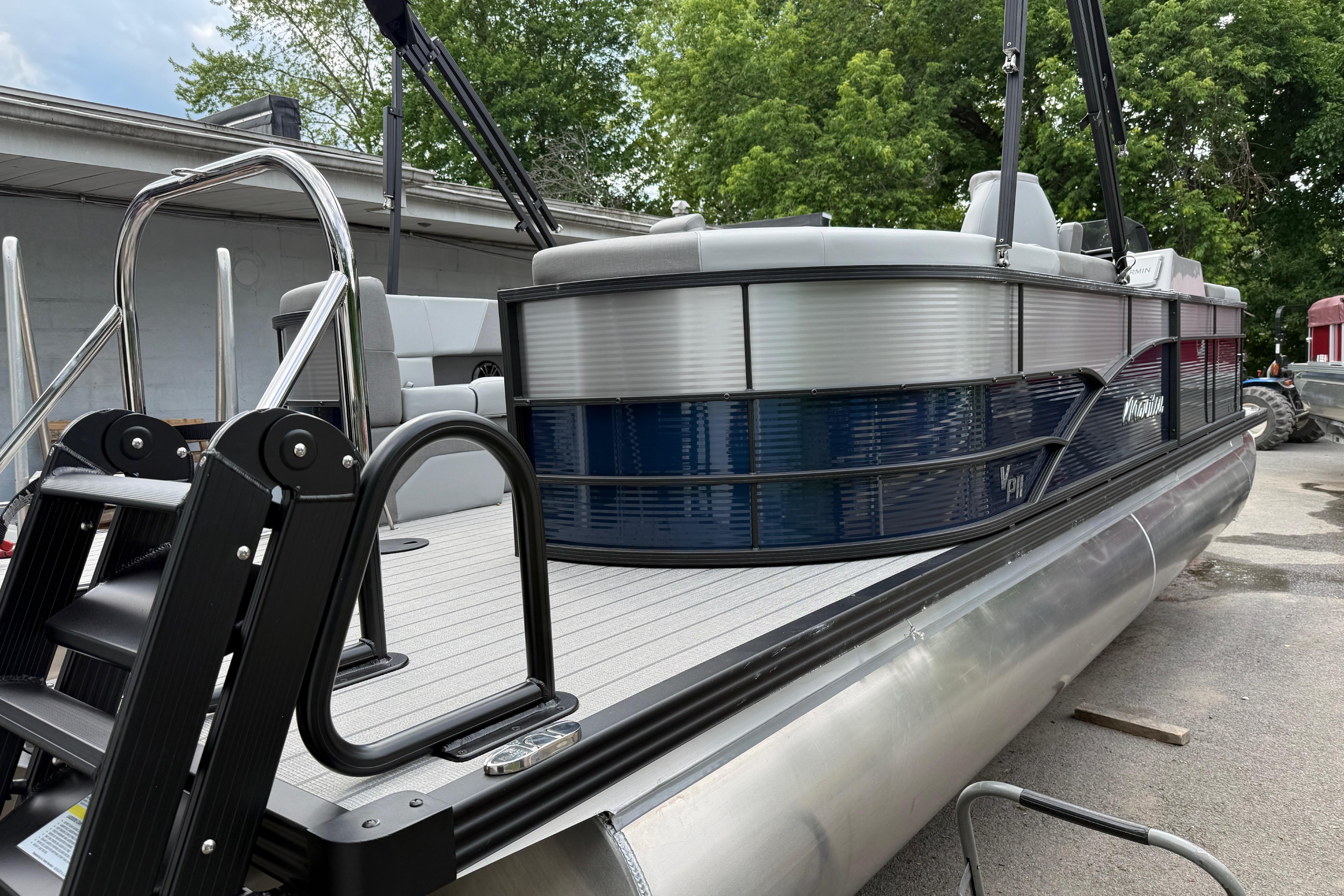 2027 Manitou Aurora RF 23 pontoon boat with sleek design and modern features.
