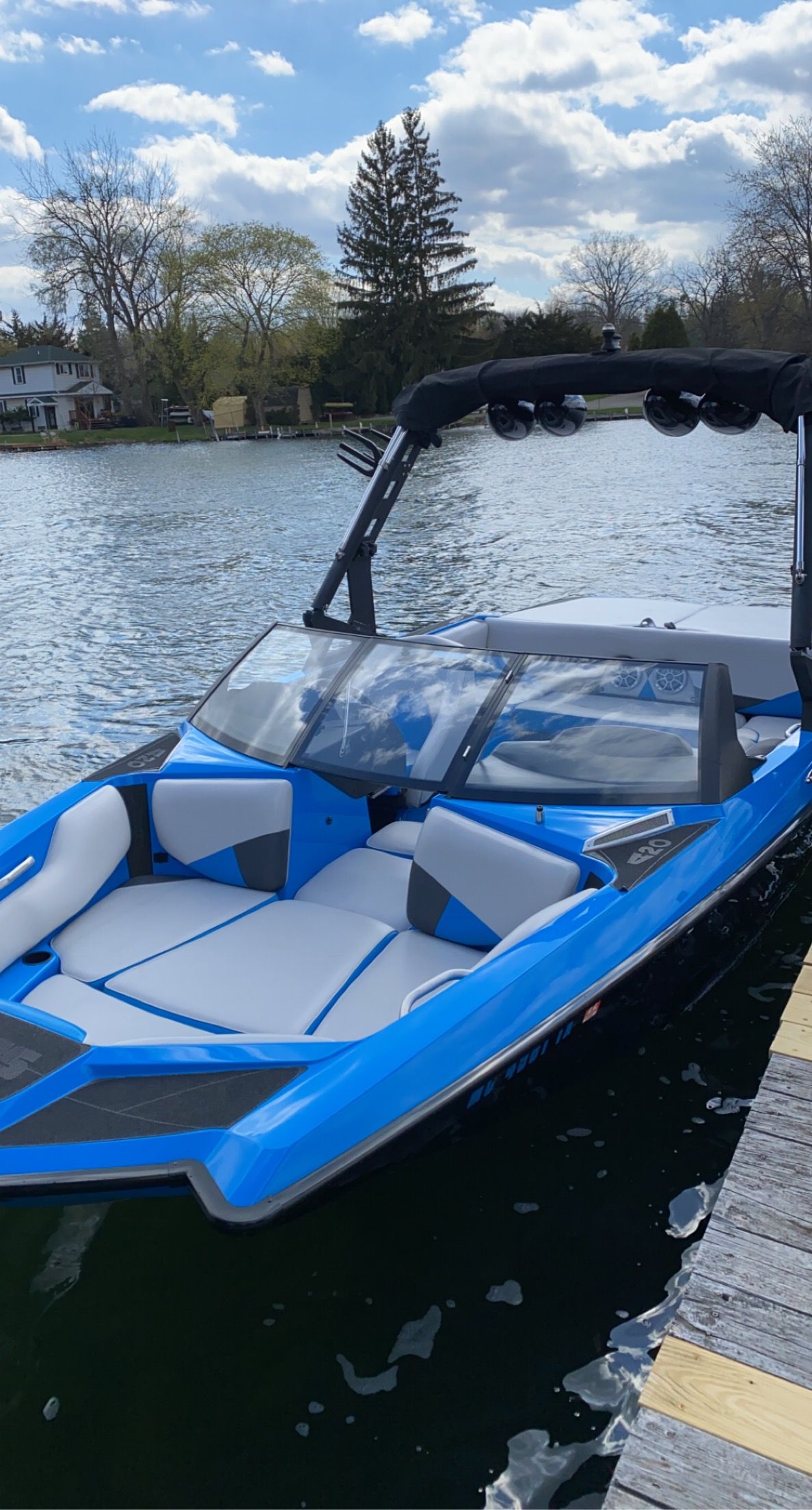 2015 Malibu Axis A20 boat on a serene lake.