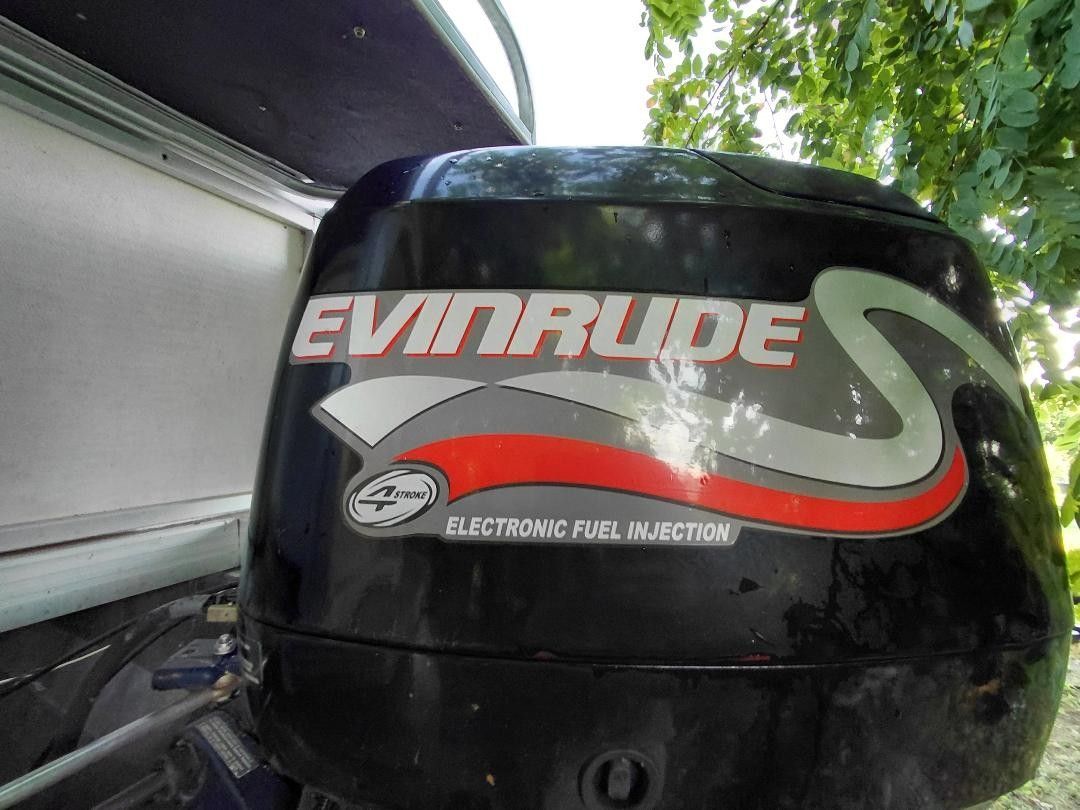 Close-up of an Evinrude outboard motor with electronic fuel injection.
