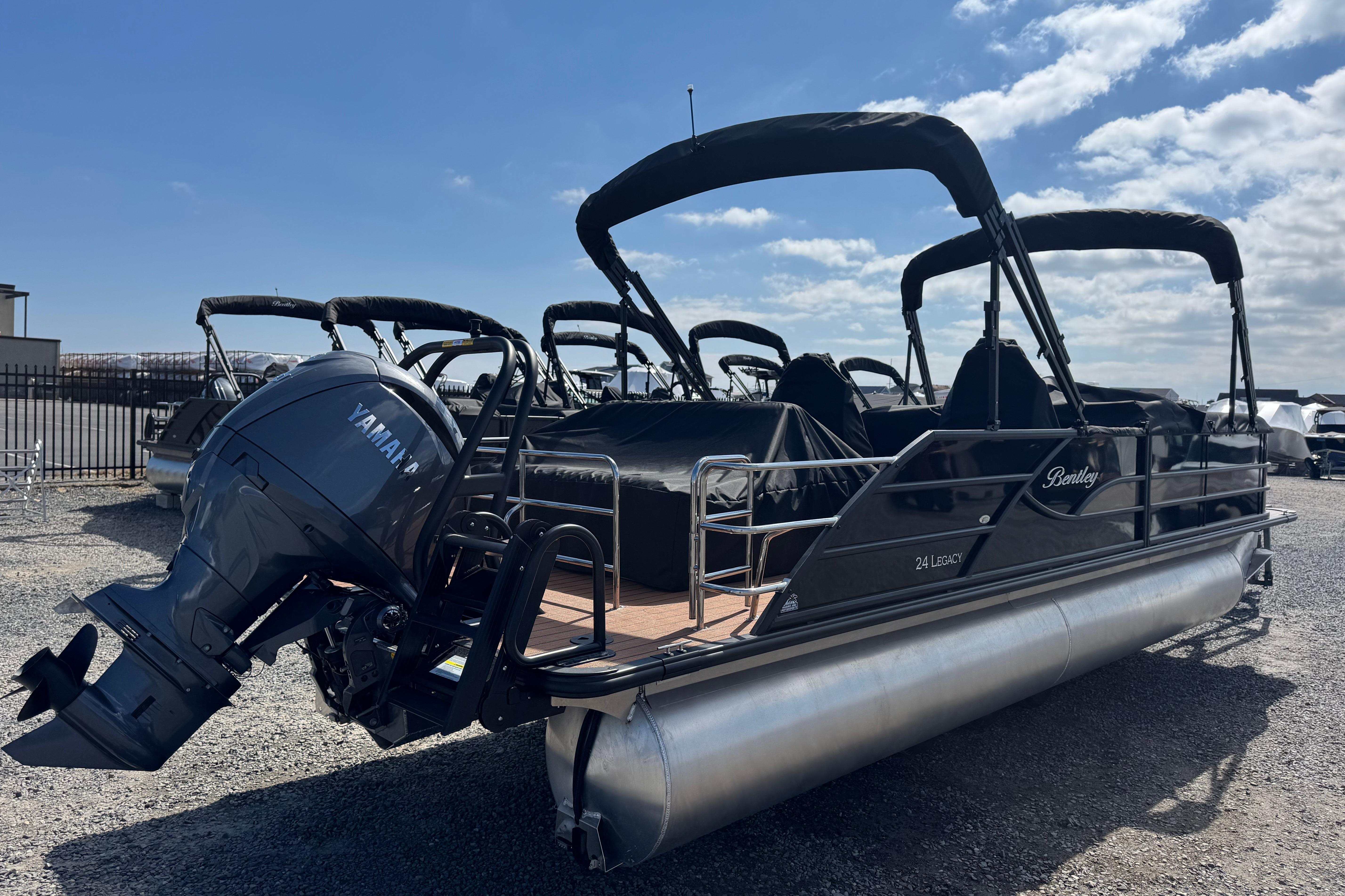 2026 Bentley Pontoons Legacy 243 Swingback with Yamaha engine, parked outdoors under a clear sky.