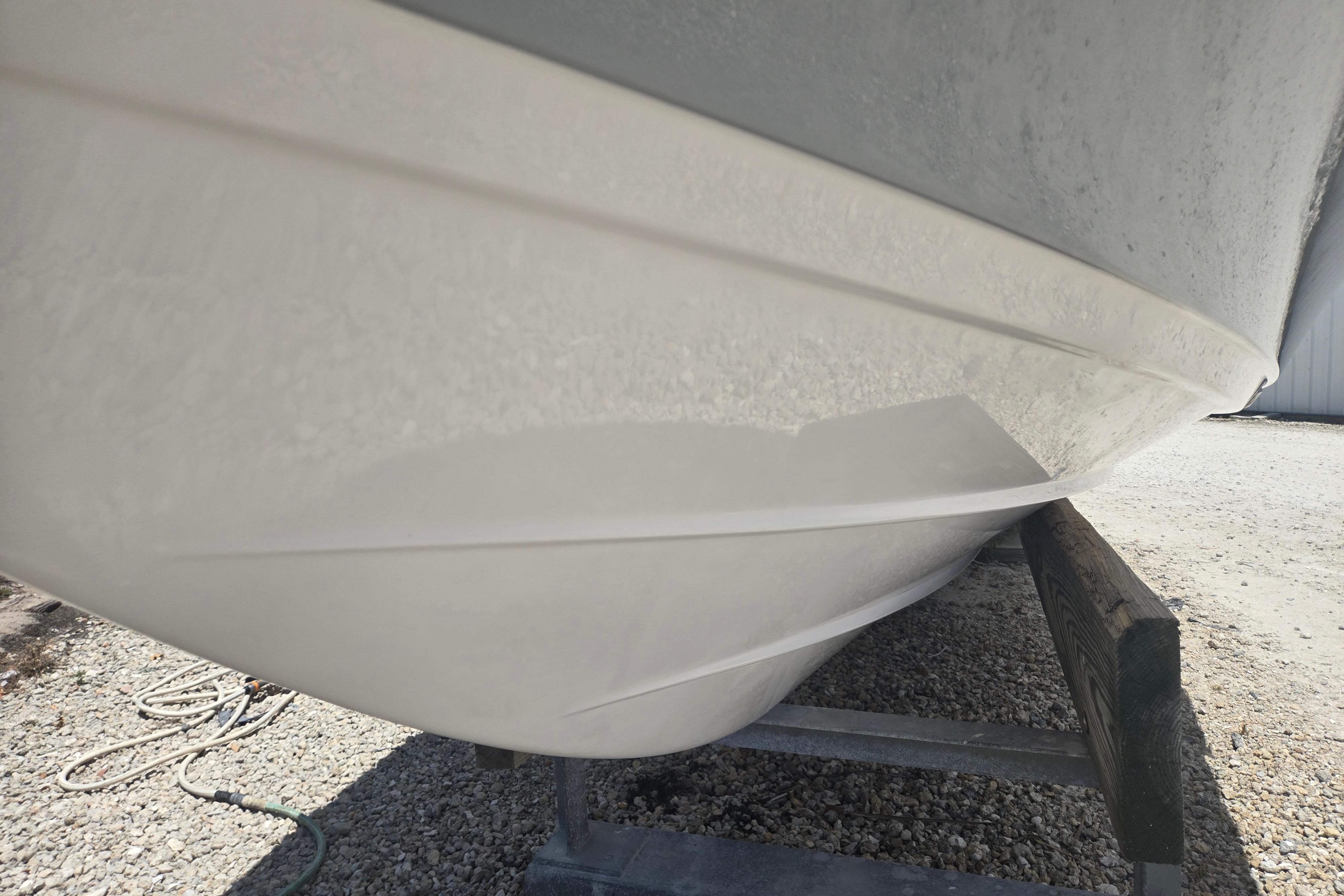 2022 Sportsman Masters 227 Bay Boat hull on trailer, side view.