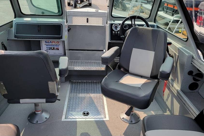 Interior of 2026 Smoker Craft Phantom 18 X2 boat with seating and steering wheel.