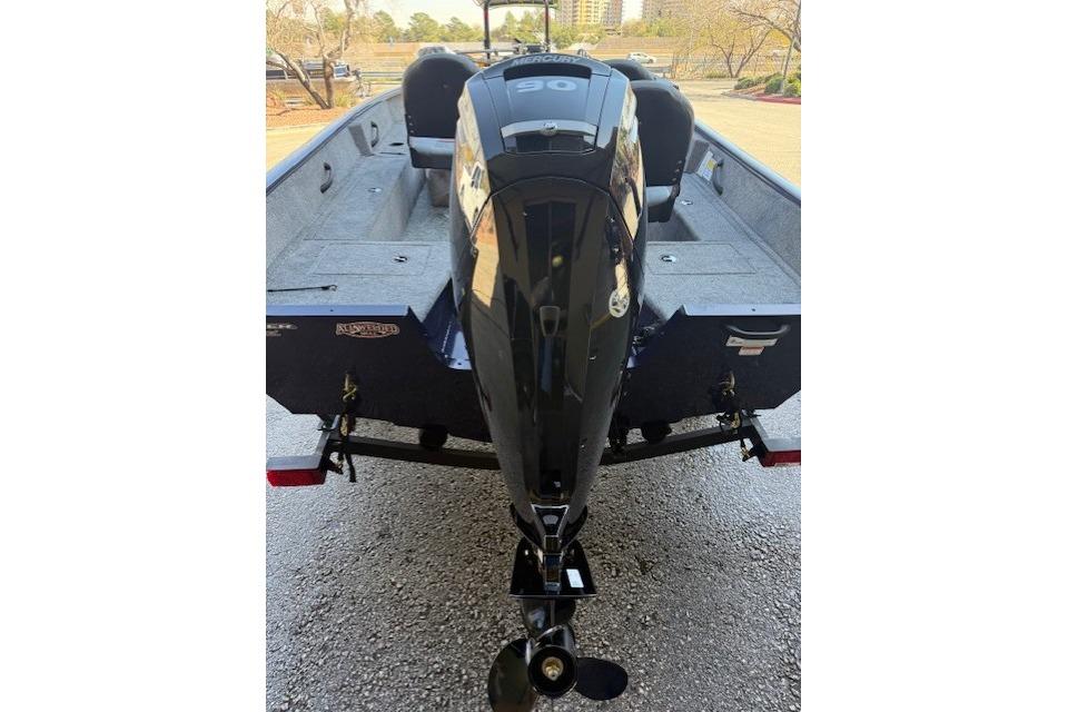 2026 Tracker Pro Guide V-16 SC boat with Mercury 90 engine, rear view.