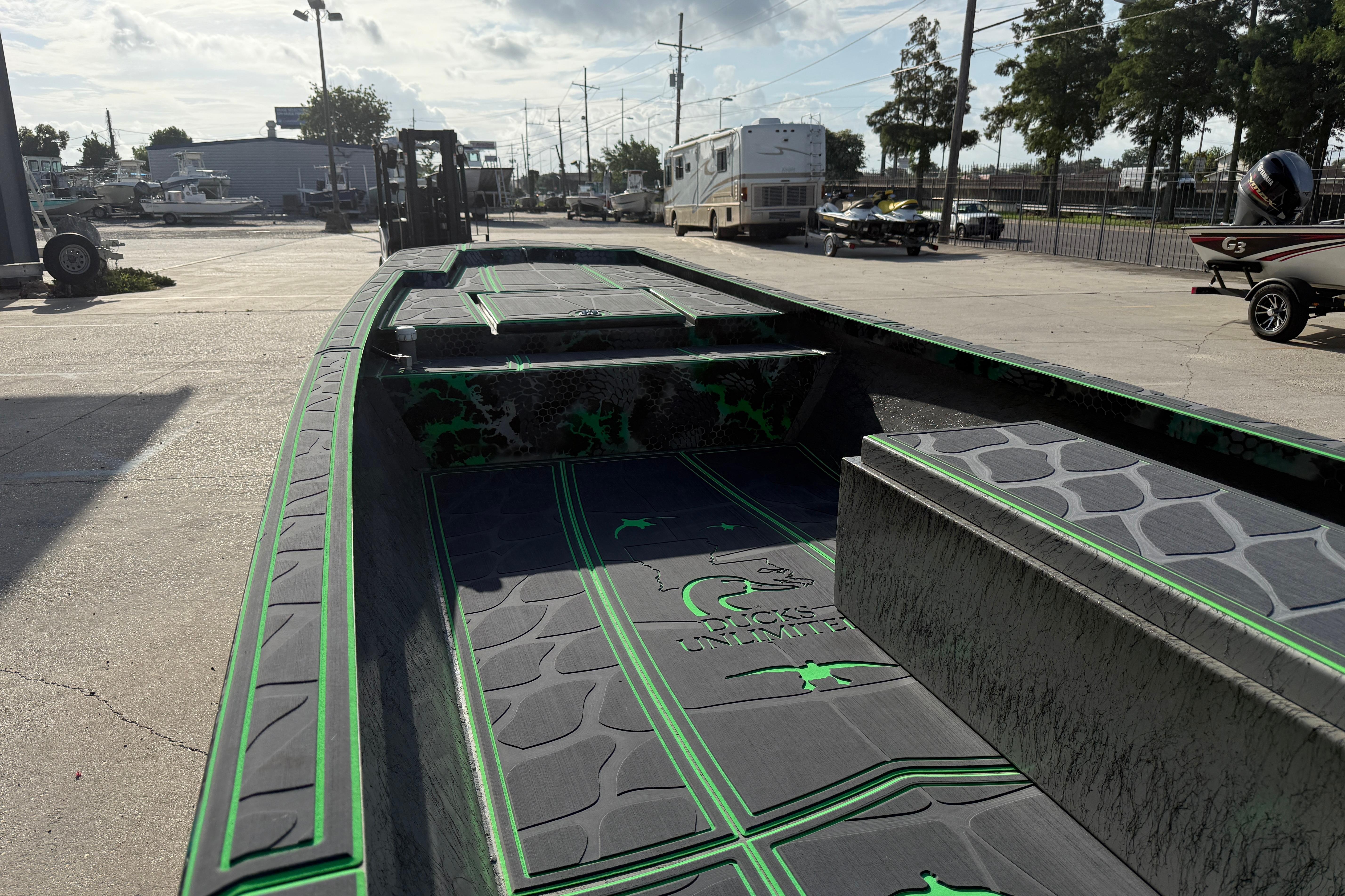 Custom Rene Gros 20x48 boat, 2024 model, with green and black interior design.