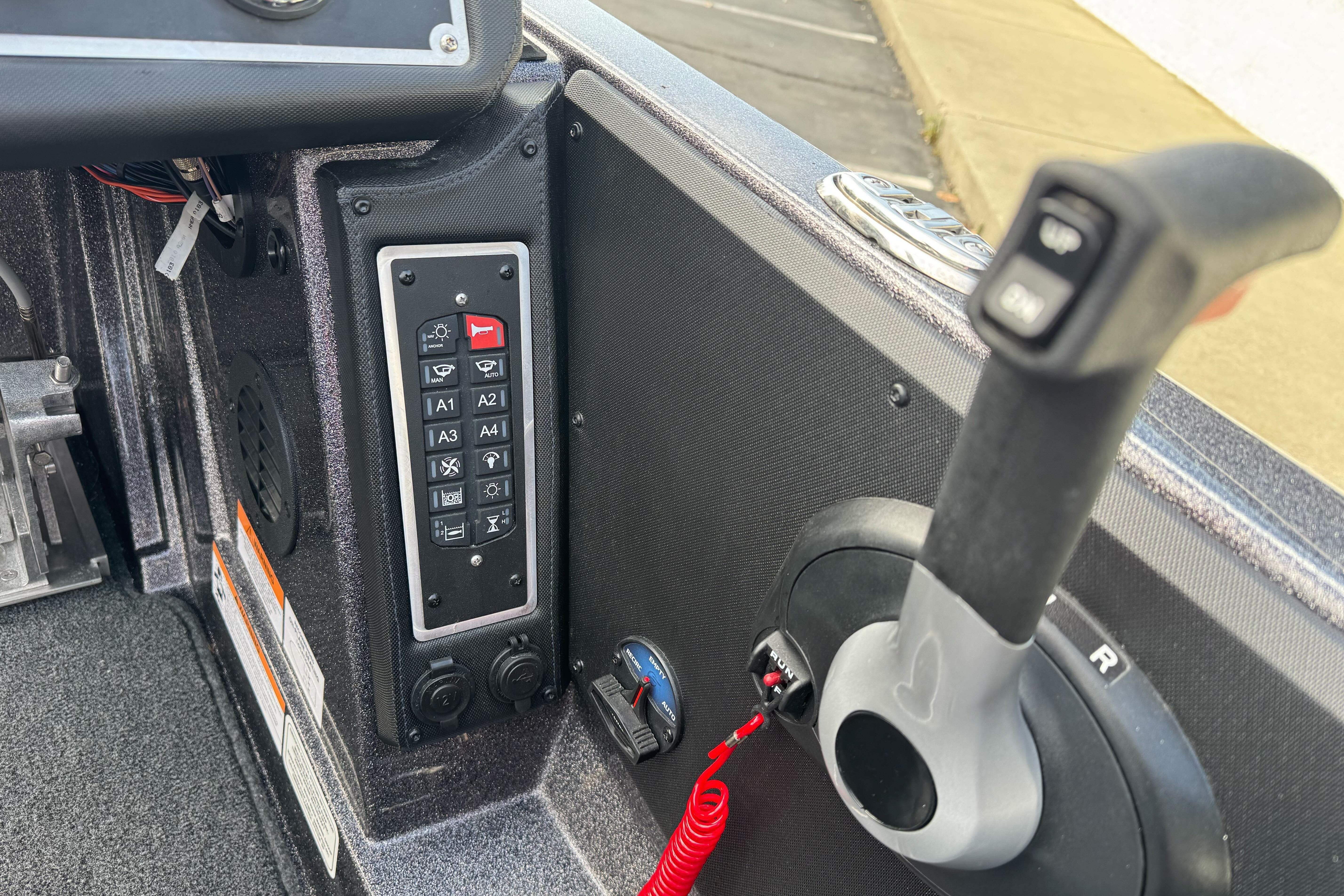2025 Ranger Z521 boat control panel with throttle and switch panel.