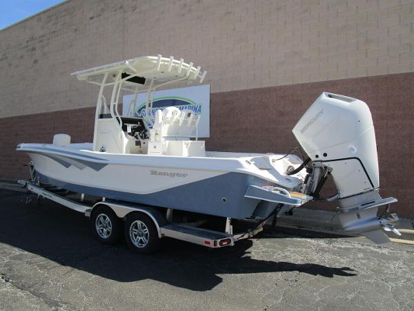 2024 Ranger 2660 Bay boat on trailer, featuring sleek design and powerful outboard motor.