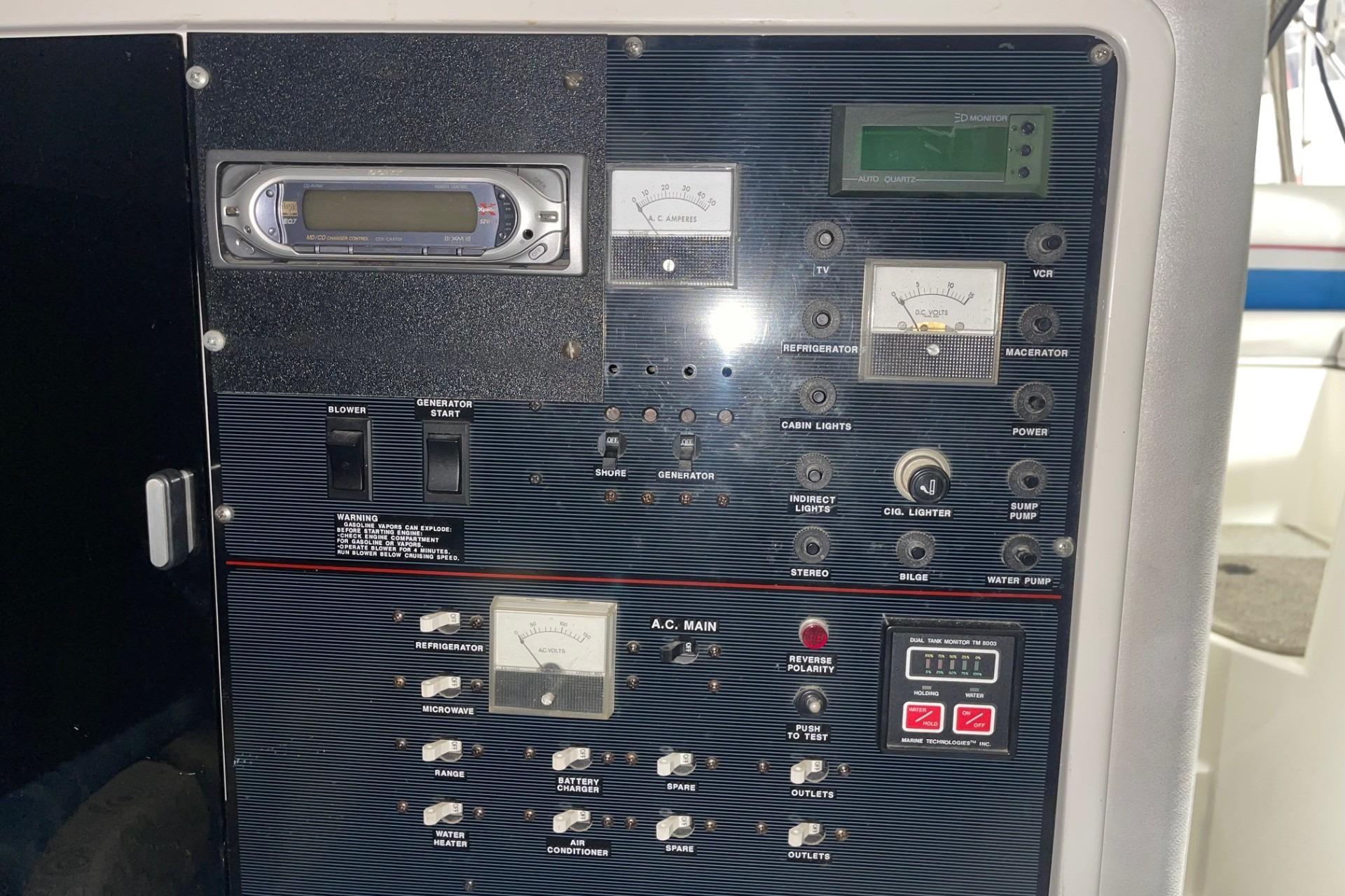 Control panel of a 1992 Chaparral Signature 30 boat with various switches and gauges.