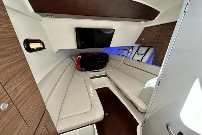 Luxurious interior of 2019 Boston Whaler 350 Realm with plush seating and modern amenities.