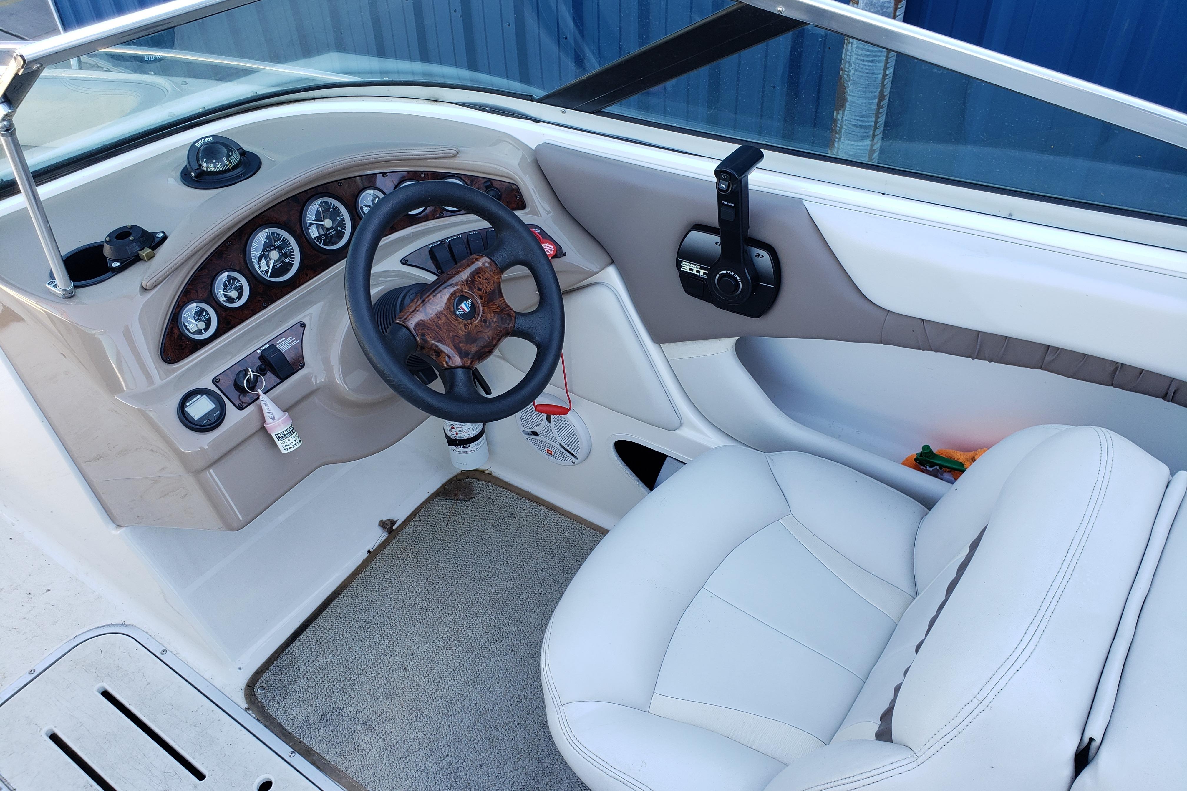 Interior of a 1998 Wellcraft Eclipse 2000 SS boat showing steering wheel and dashboard.