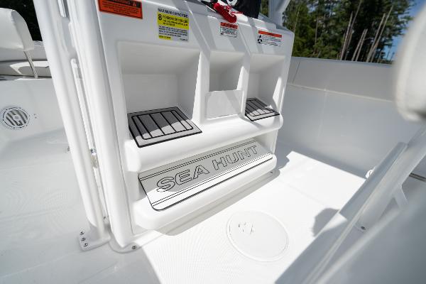 2024 Sea Hunt Ultra 234 boat interior with branded step and storage compartments.