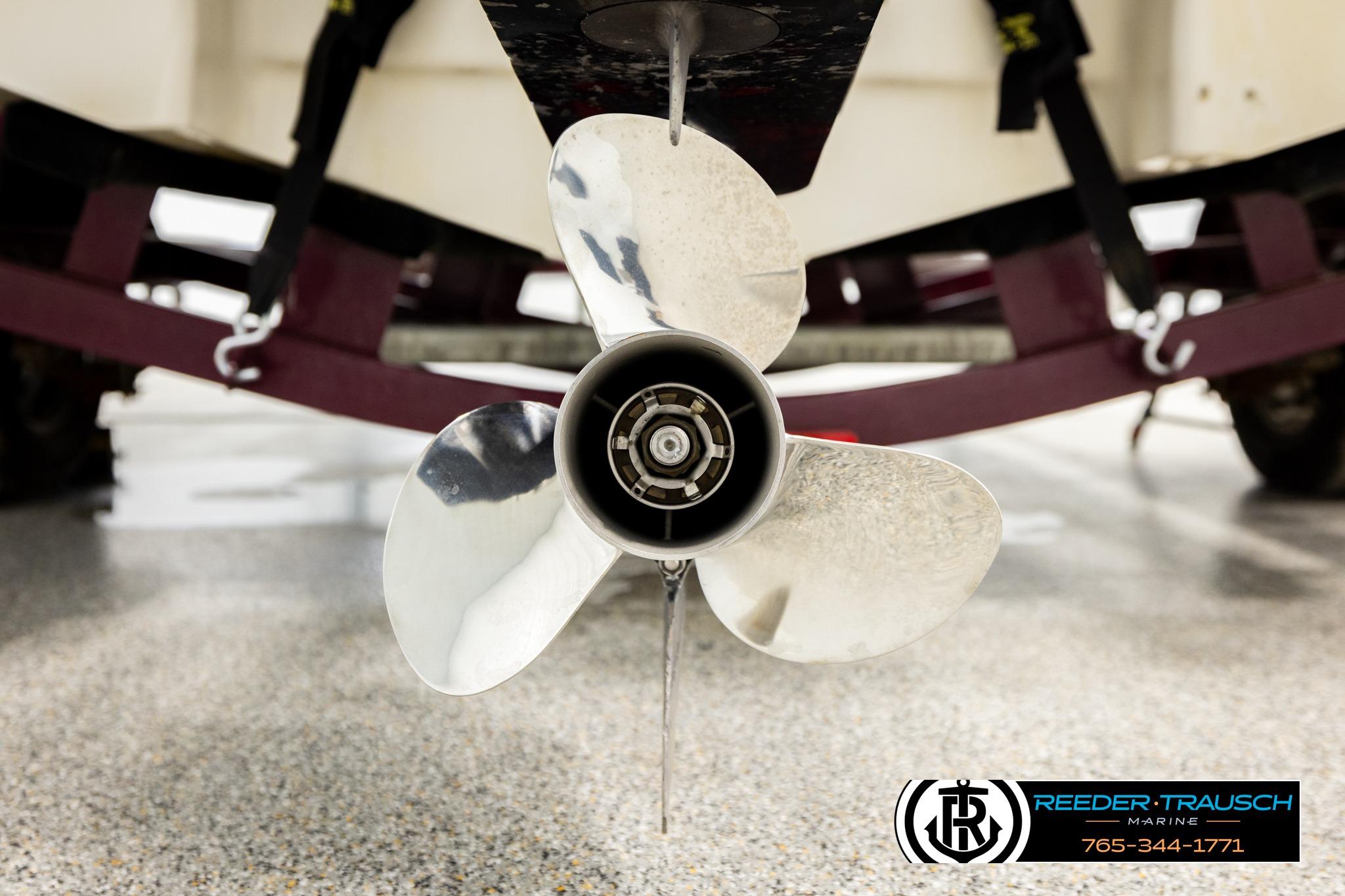 Close-up of a 2016 Tahoe 450 TS boat propeller on a trailer.