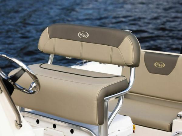 2025 Key West 179 FS boat seating with beige upholstery on a calm water backdrop.