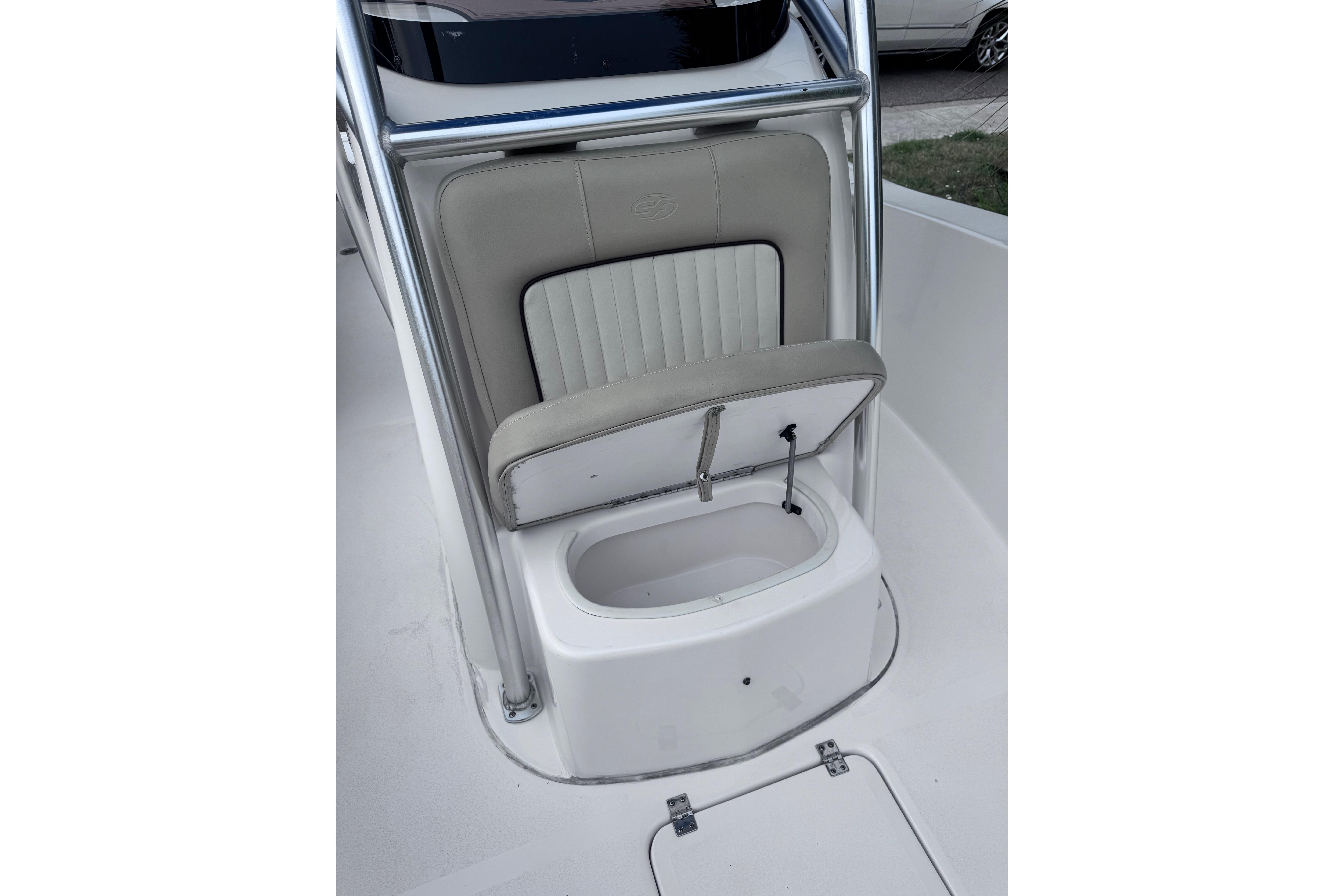 2018 Sea Fox 206 Commander boat seat with storage compartment open.