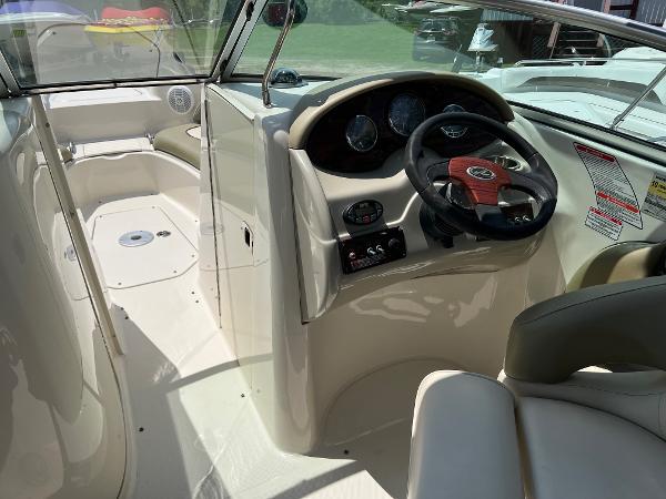 2005 Sea Ray 220 Sundeck boat interior with steering wheel and dashboard.