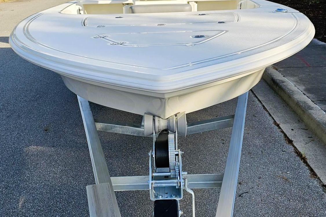 2026 Mako 18 Pro Skiff boat on trailer, viewed from the front.