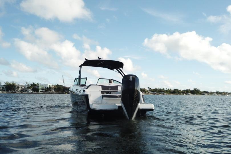 2022 Monterey 255SS Super Sport boat on water under blue sky.