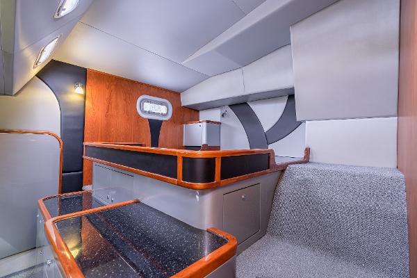 Interior of 2025 Shuttleworth 52 AeroRig yacht, featuring modern design with wood and gray accents.