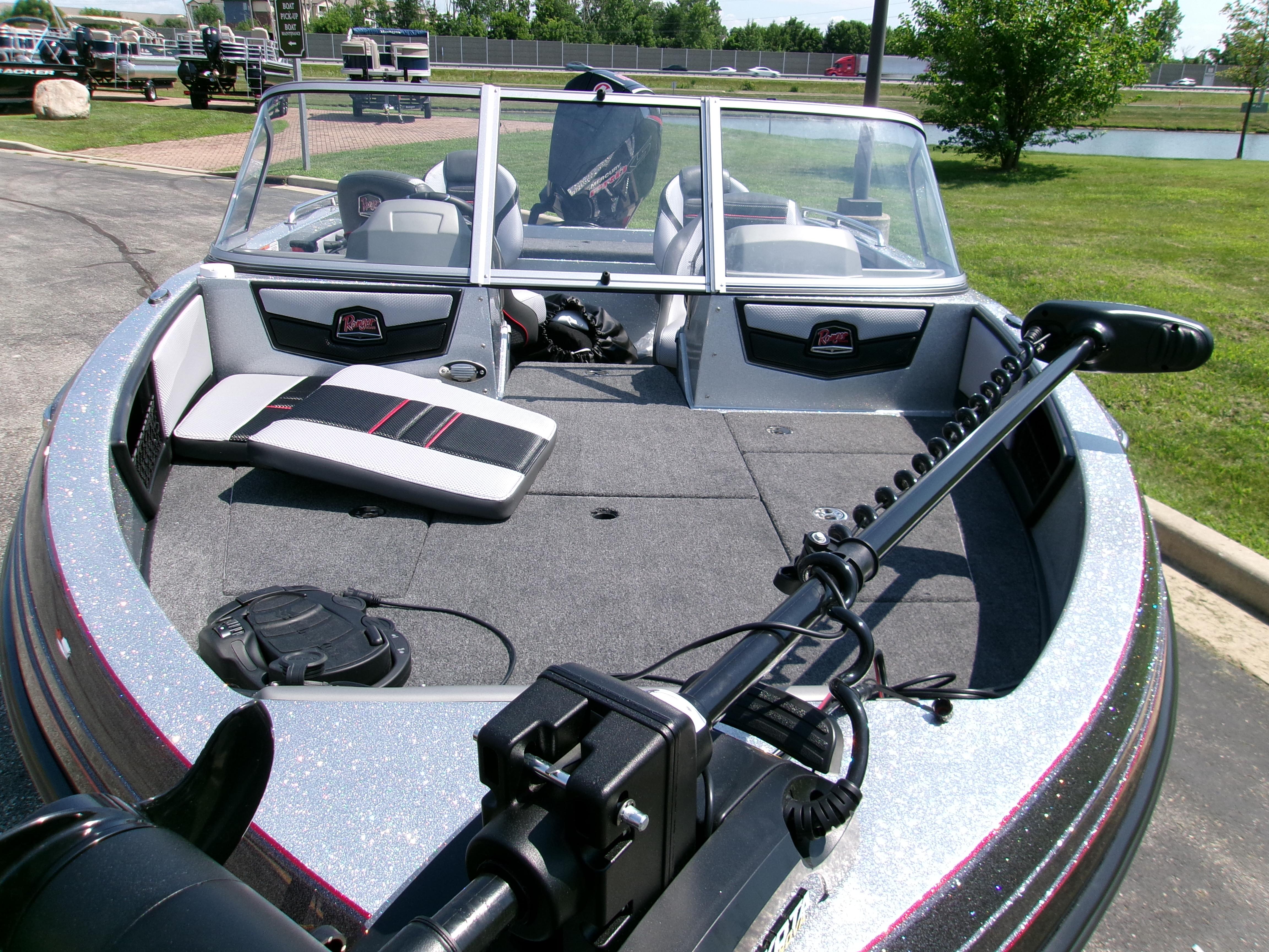 2025 Ranger 1880MS boat with spacious deck and modern seating, parked outdoors.