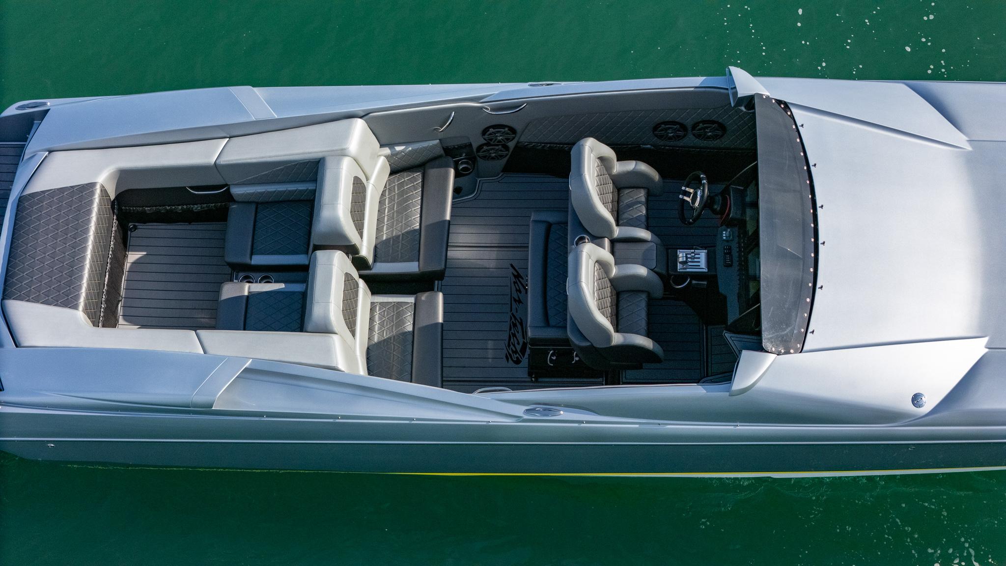 2017 Nor-Tech 3900 Super-VEE boat, aerial view, sleek design, spacious seating, on green water.