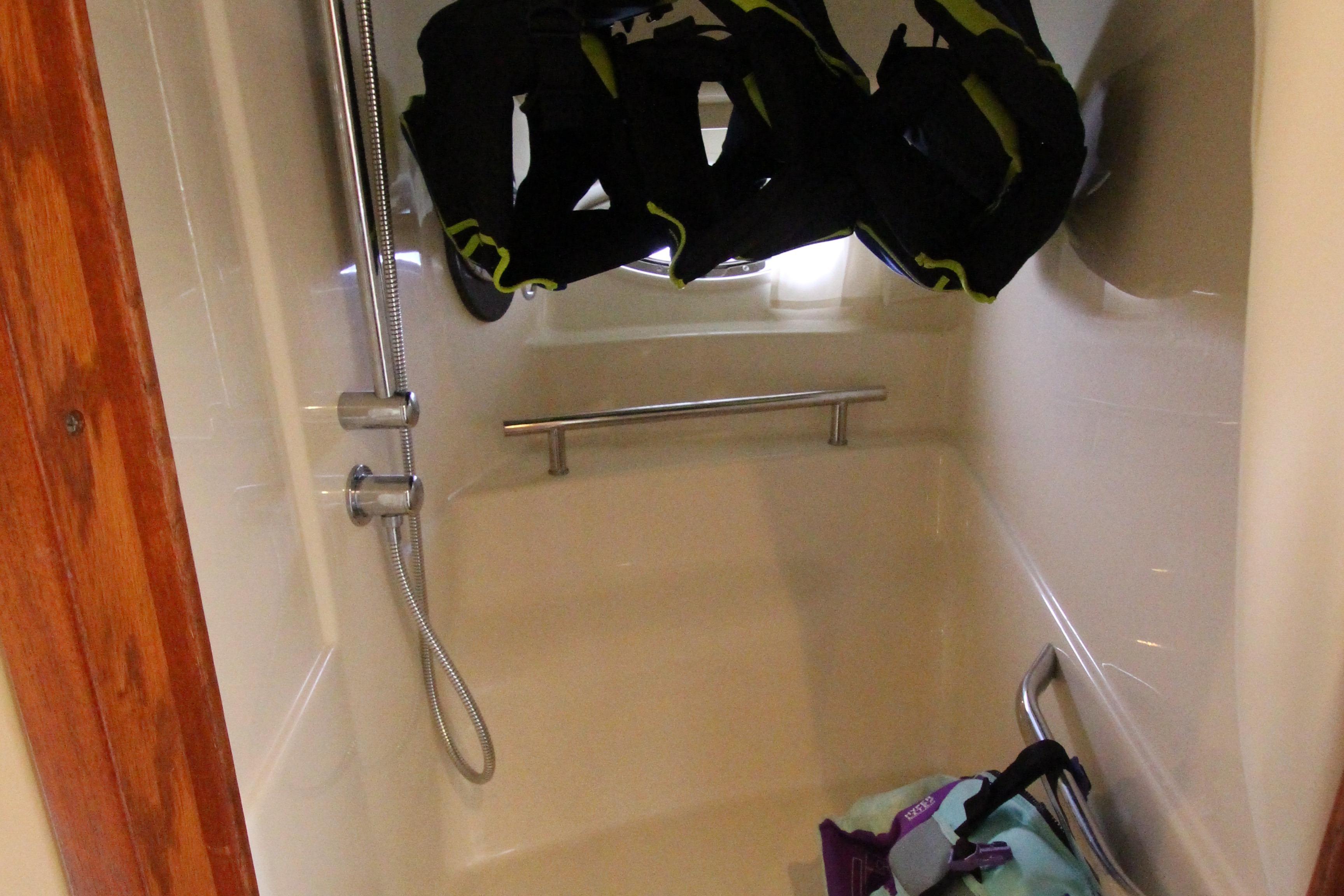 Shower area in 2004 Sea Ray 40 Sundancer with hanging life jackets.