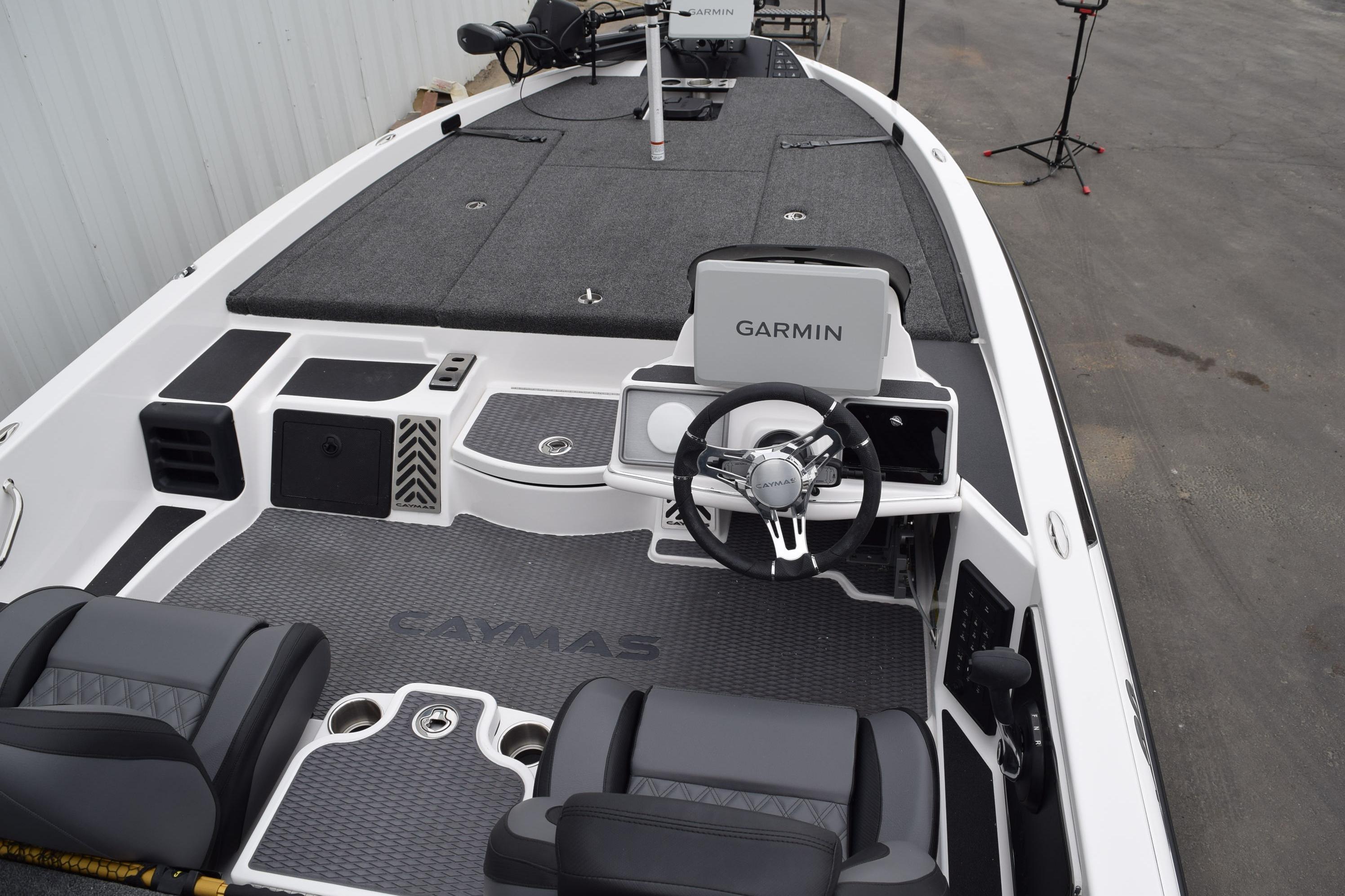 2027 Cayams CX 20 Pro boat interior with Garmin navigation system and sleek seating.