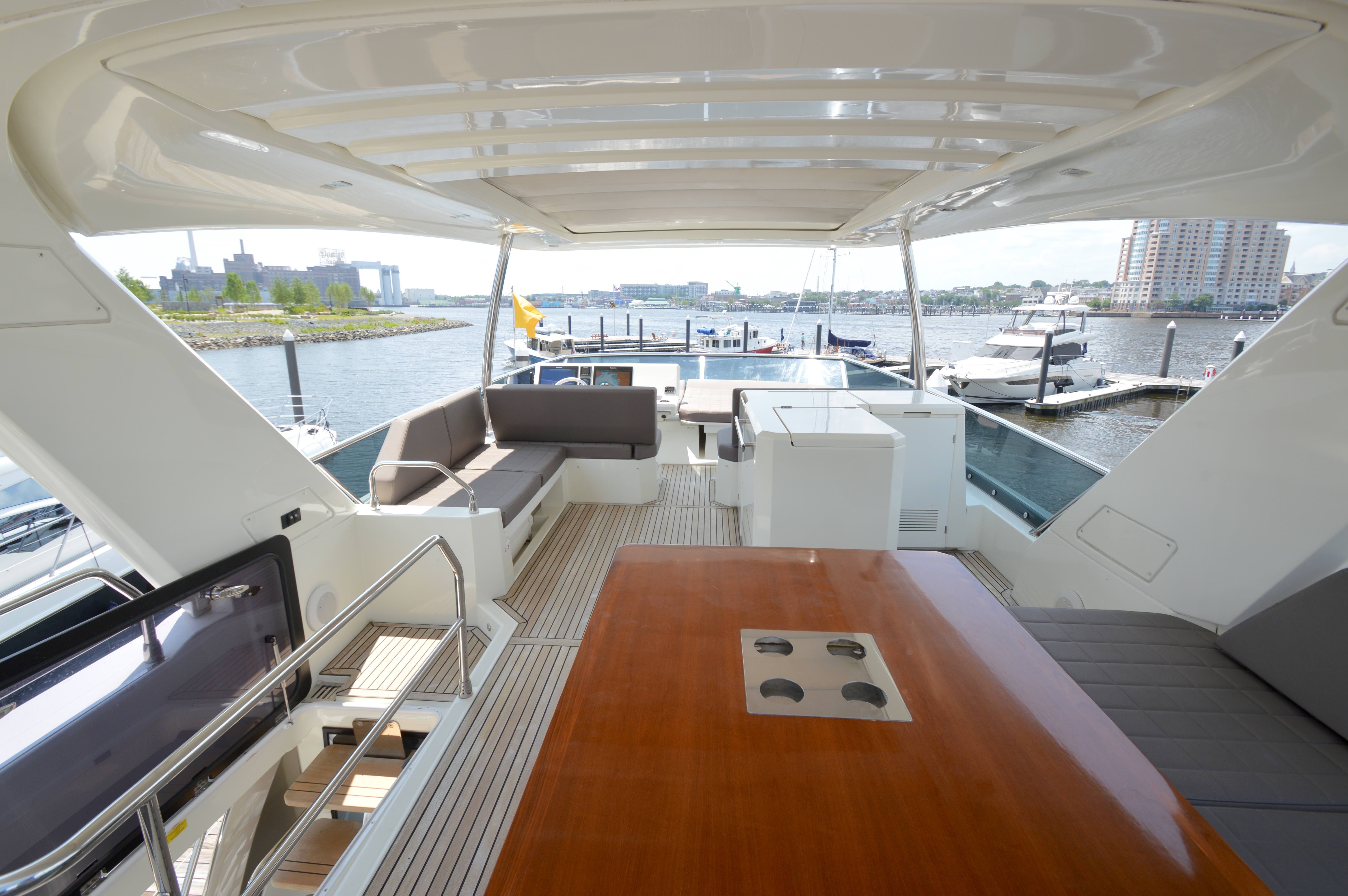 Luxurious interior of a 2017 Prestige 630 yacht docked at a marina.