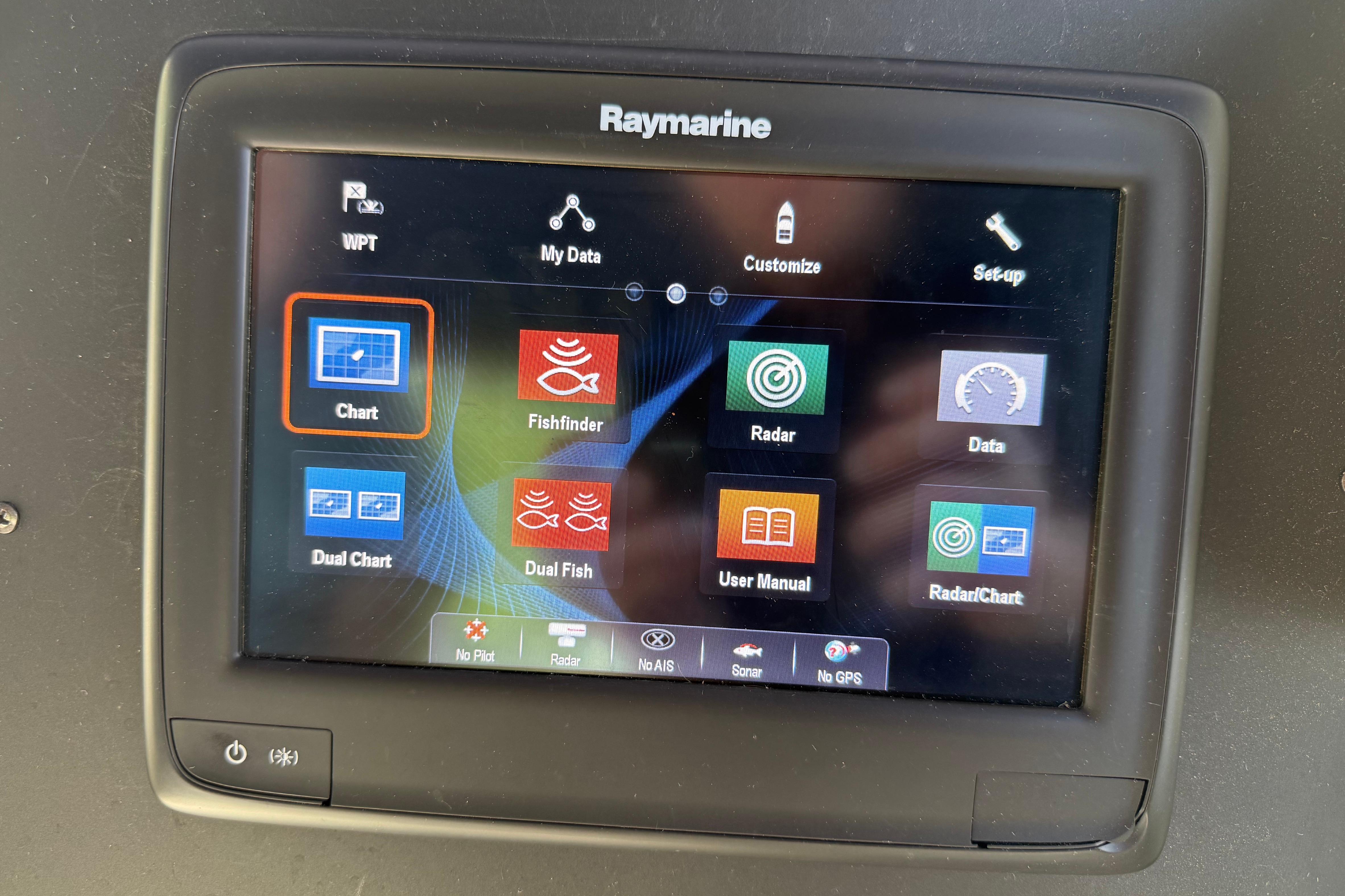 Raymarine navigation display on 1995 Carver 370 Voyager, showing chart and radar options.