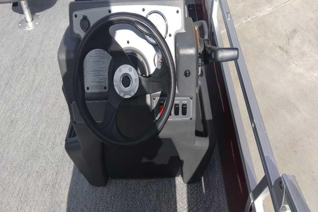 Steering console of 2026 Sun Tracker Bass Buggy 18 DLX pontoon boat.