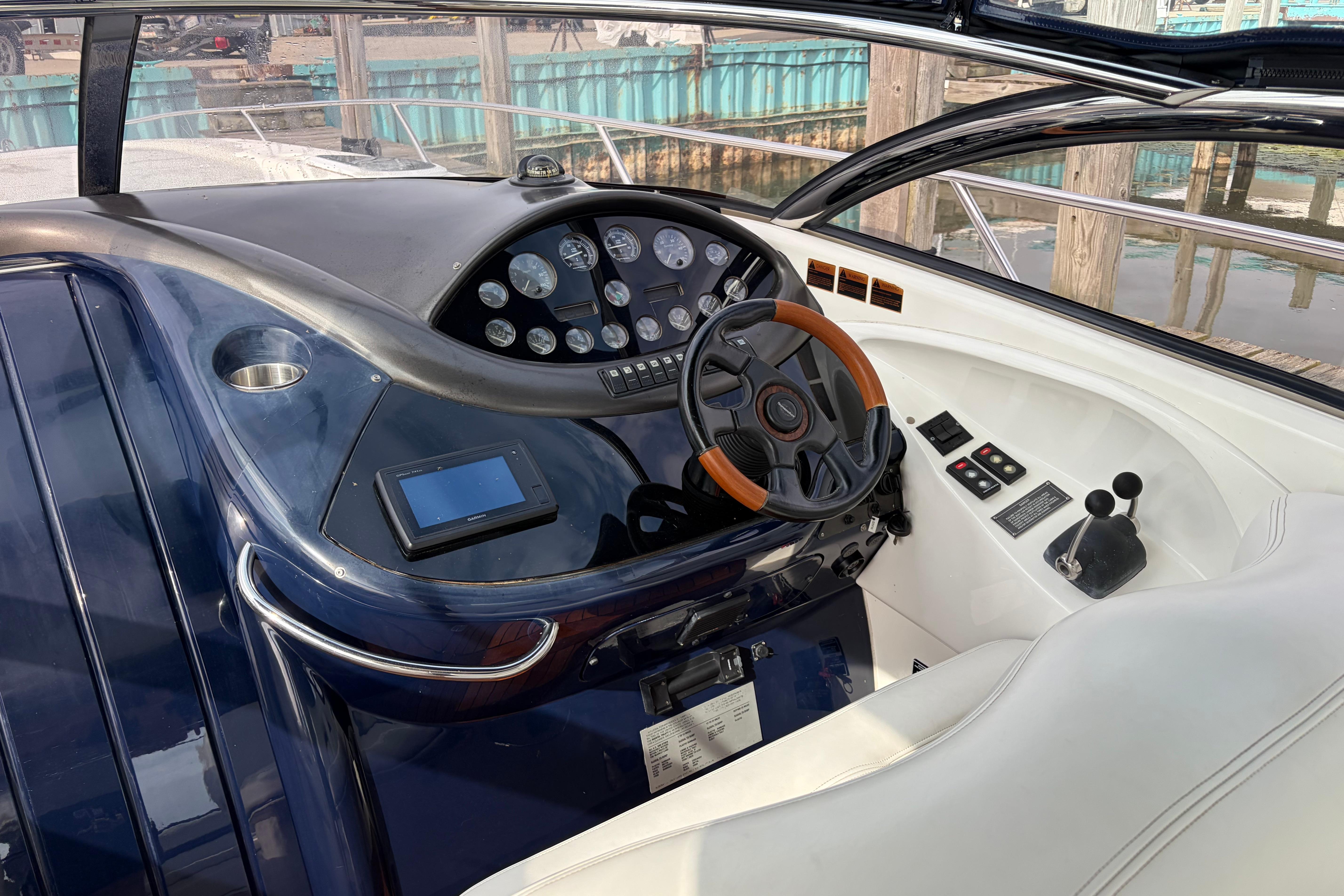 Cockpit of 2000 Sunseeker Superhawk 34 with steering wheel and control panel.