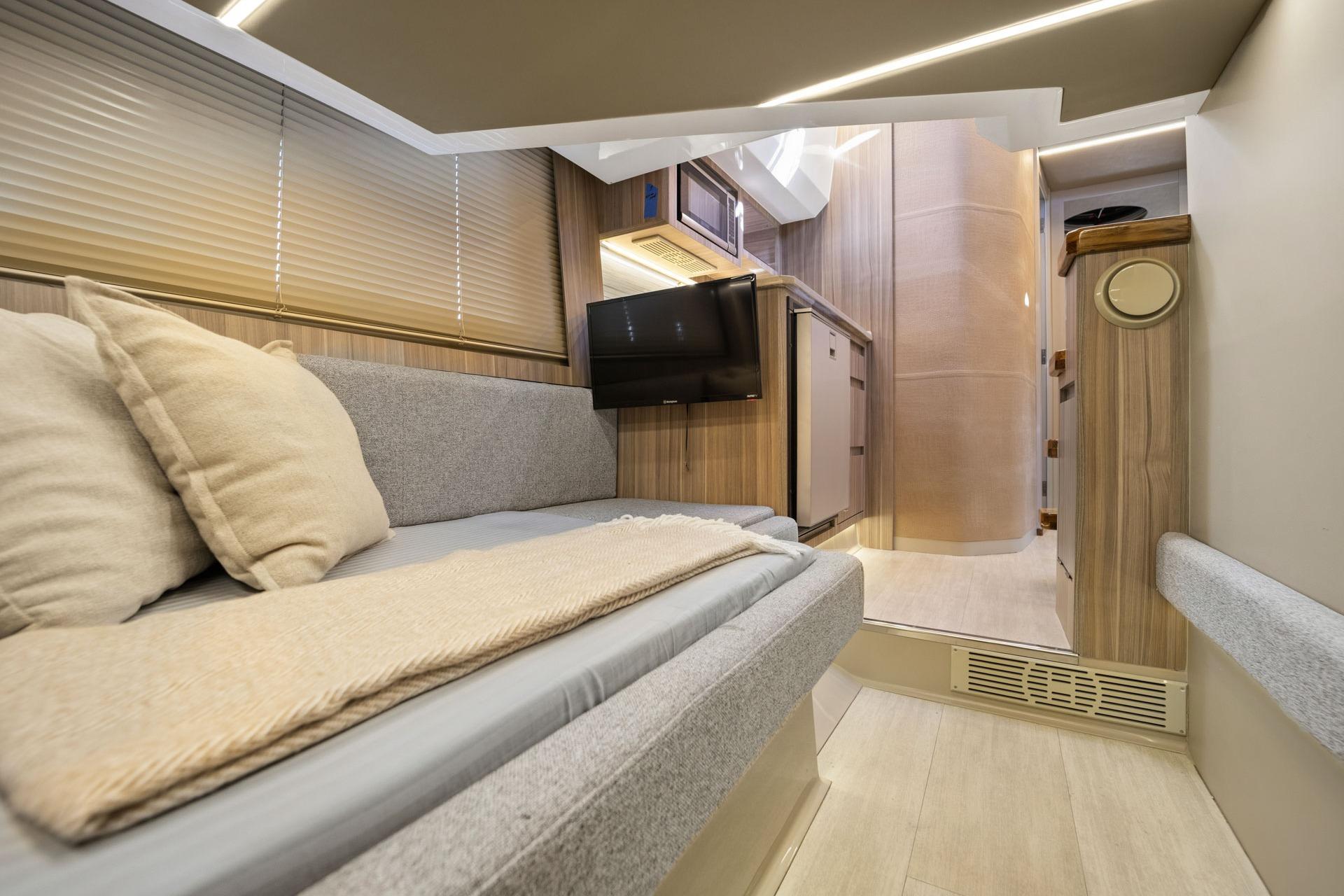 Luxurious interior of 2026 Hanover 447 RV with modern amenities and cozy seating.