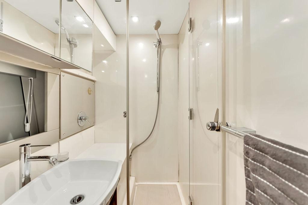 Luxurious bathroom in 2012 Fairline Targa 58 yacht, featuring modern fixtures and sleek design.