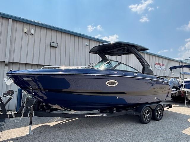 2026 Chaparral SSX 6 boat on trailer, parked outdoors under a clear sky.